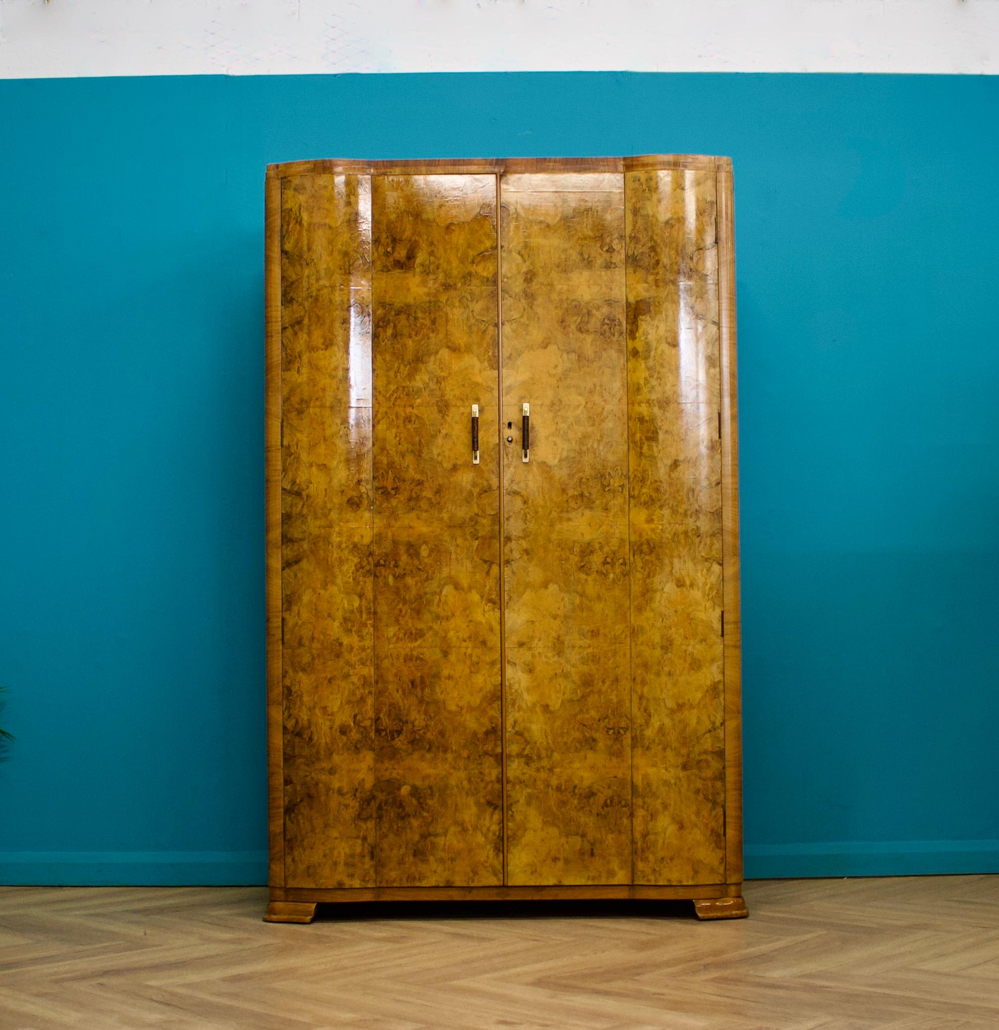 An Art Deco walnut wardrobe    - circa 1930's
Fitted out with a clothes rail, a pull out clothes rail and a shelf