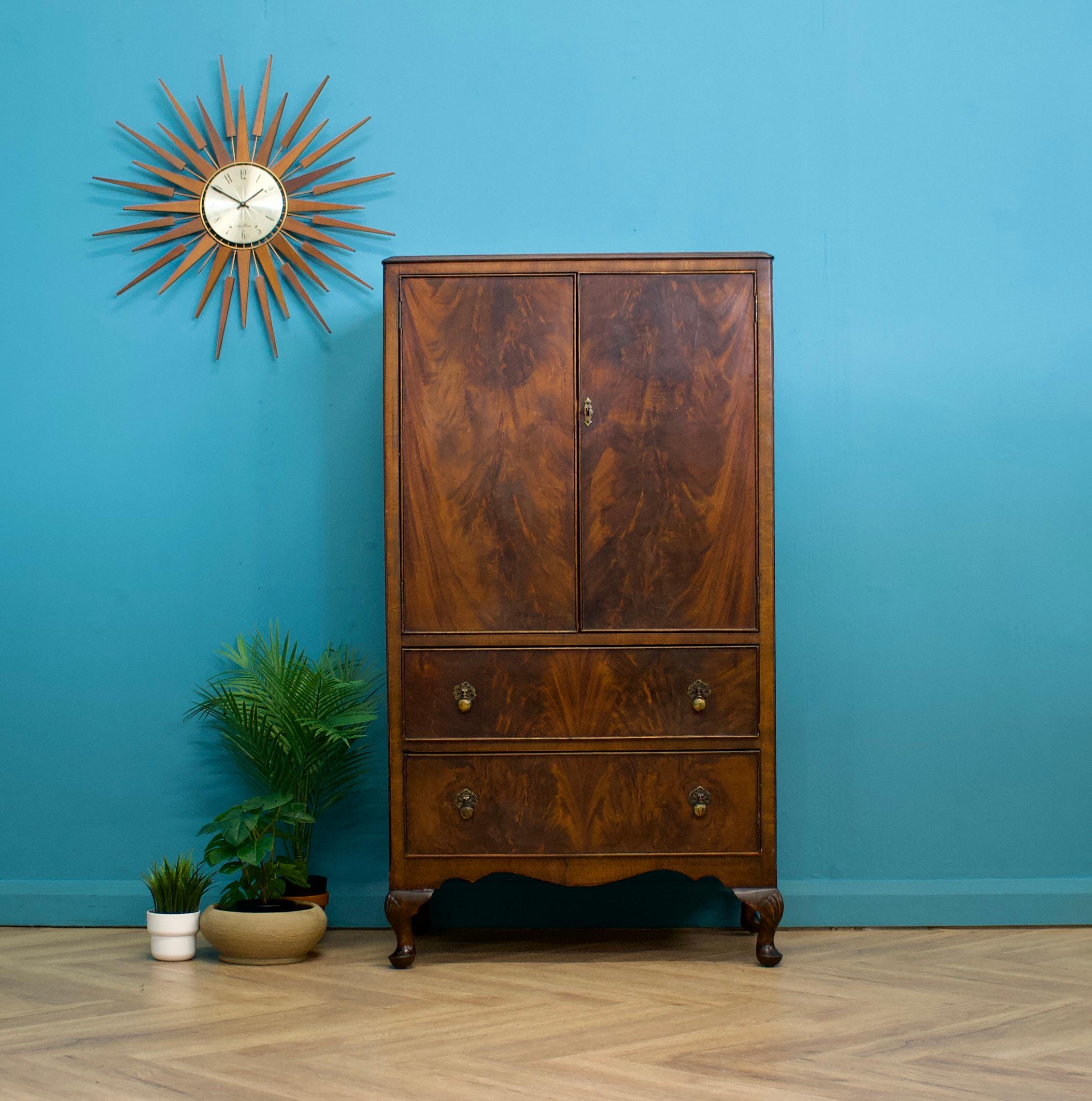 A mid century Art Deco style tallboy - circa 1950's
Featuring a cupboard with a shelf and two drawers - each with solid brass handles