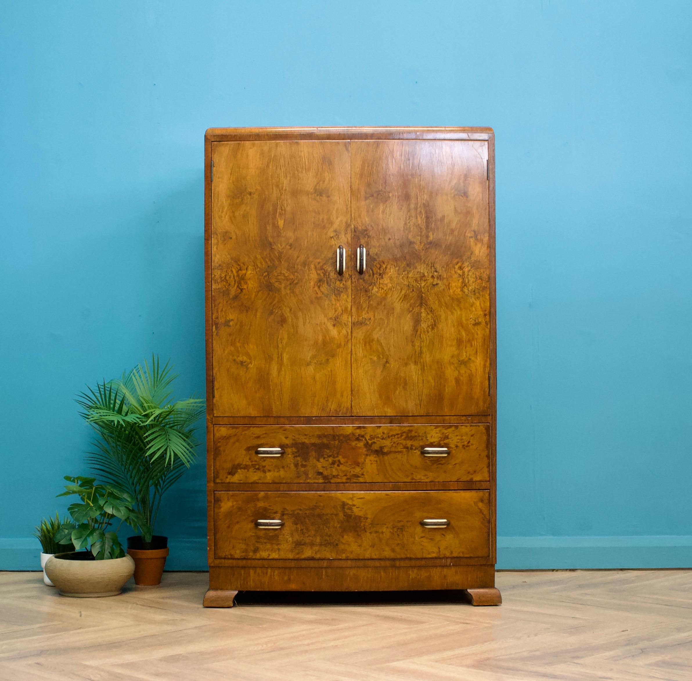A mid century Art Deco style tallboy - circa 1950's
Featuring a cupboard with a shelf and two drawers - each with bakelite handles