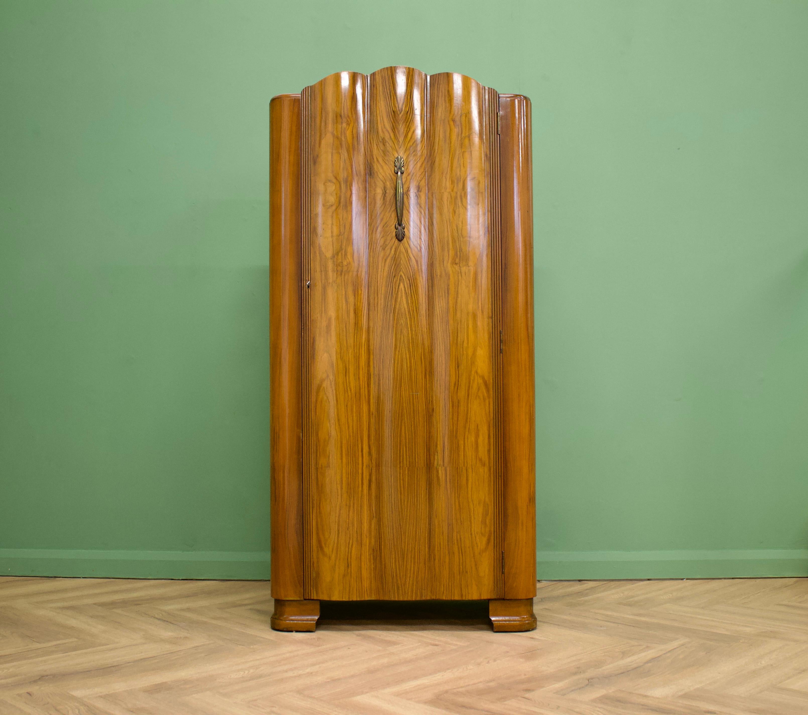 -- Art Deco style serpentine wardrobe
- Manufactured in the UK by Harris Lebus
- Featuring a serpentine front, internal shelves and a rail
    