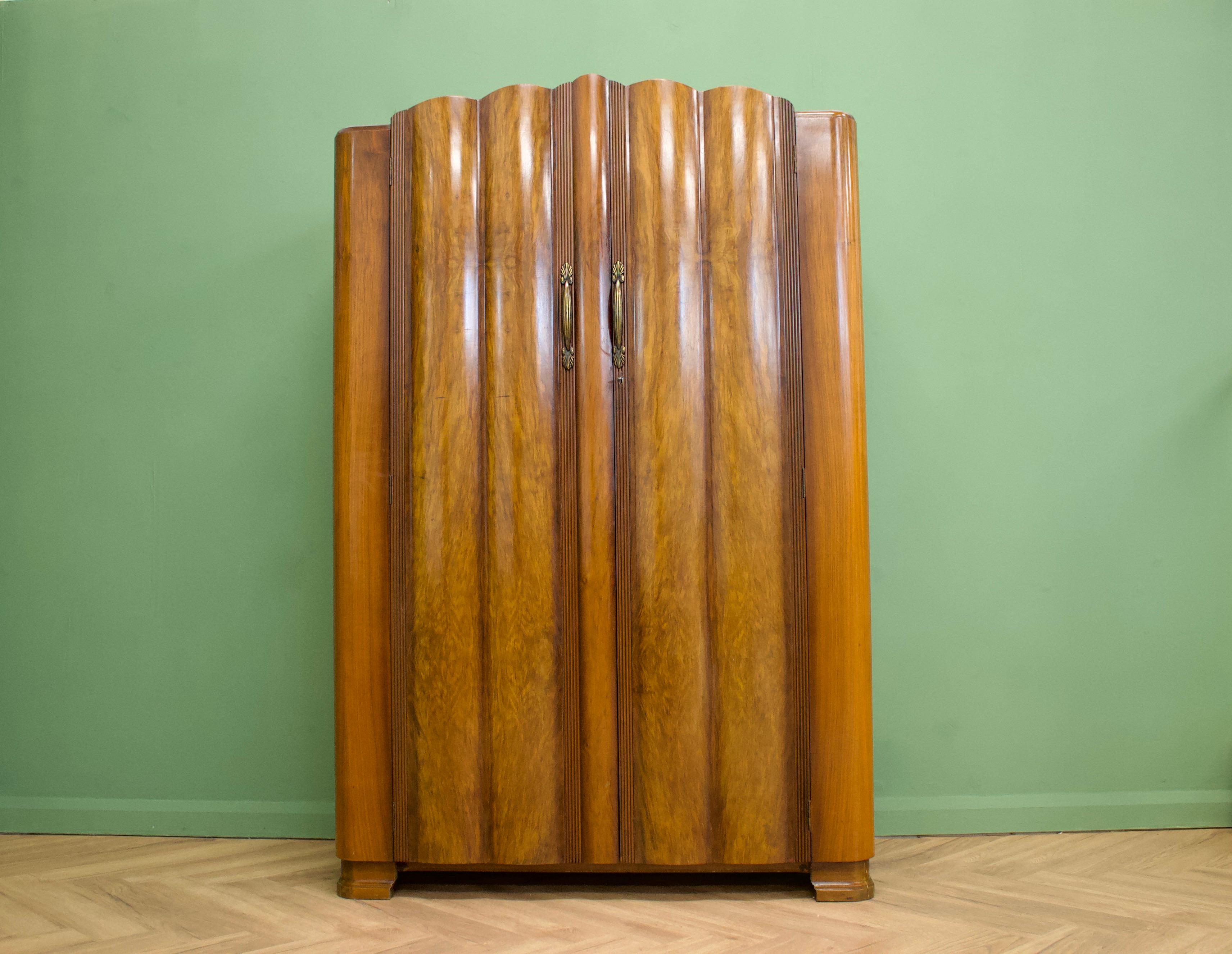 -- Art Deco style serpentine wardrobe
- Manufactured in the UK by Harris Lebus
- Featuring a serpentine front
- Two rails and a shelf.
   
