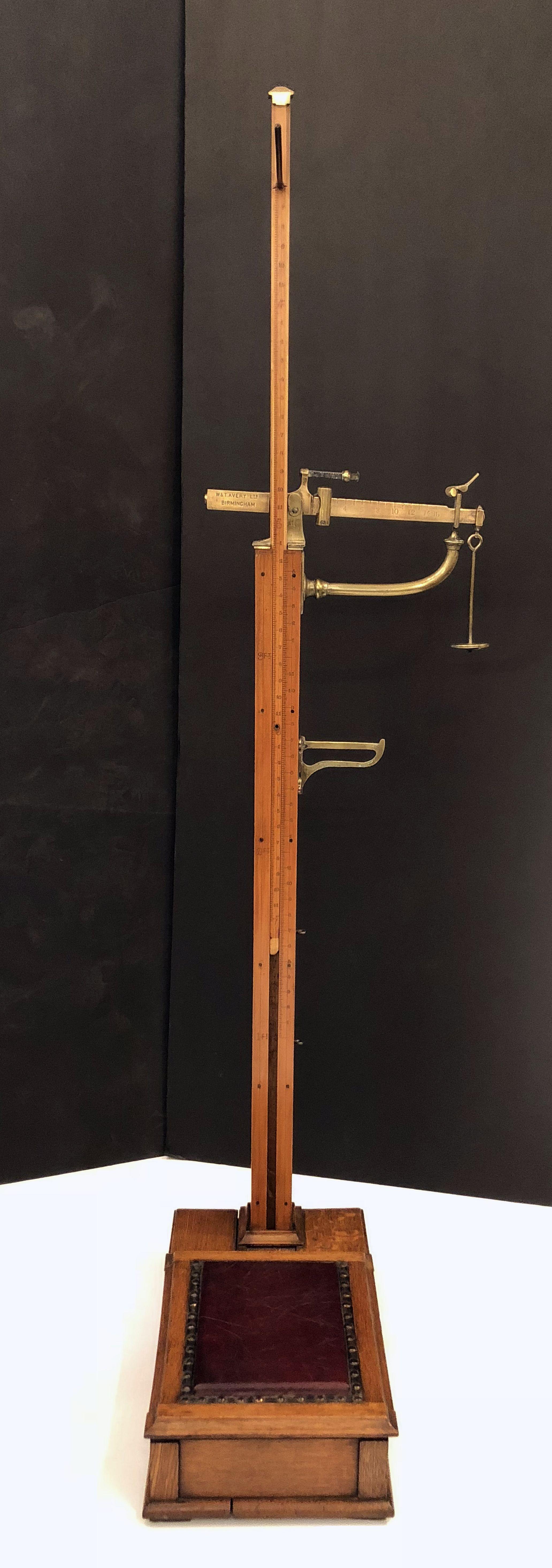 A large fine English athlete's or sportsman's personal standing floor scale, from the Edwardian era, featuring a platform of oak, boxwood, and brass.
With storage for brass weights and nail-head leather cushion footrest.

From the highly regarded