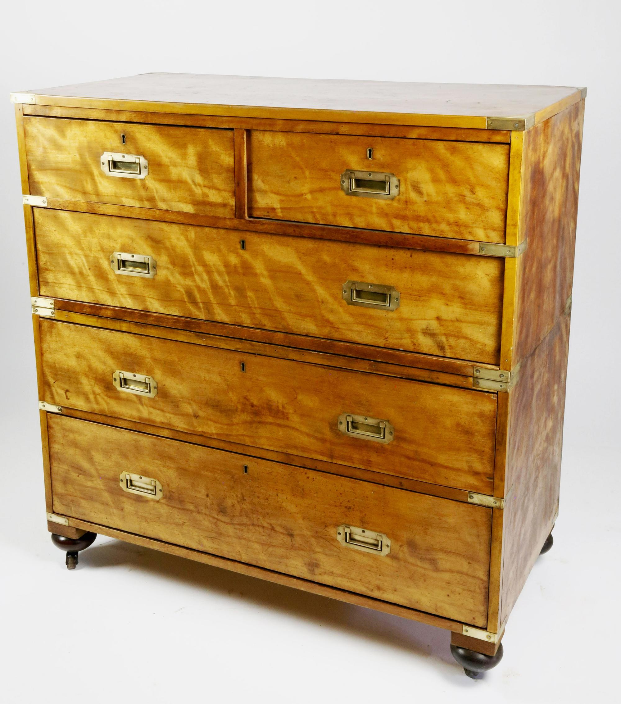 British campaign chest of drawers in flame birch,
Circa 1840

The beautifully colored flame birch campaign chest of drawers is in two parts with two drawers side by side at the top and three long drawers below with original brass pulls to each