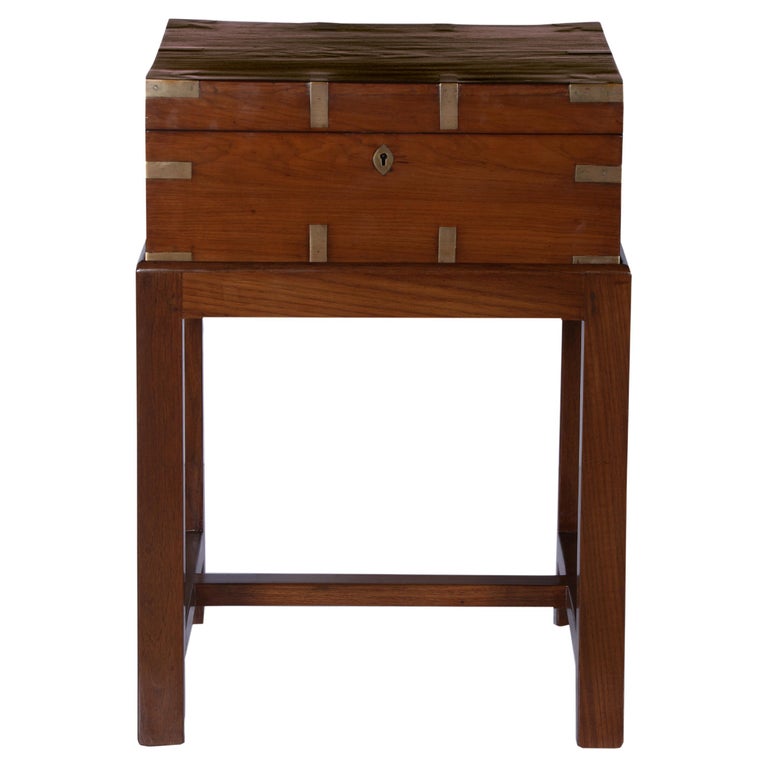 British Campaign mahogany officer's chest on a custom made stand, also in mahogany. These were used by the officers for their personal effects and were designed to travel with them wherever they were stationed. This has compartments on the top and