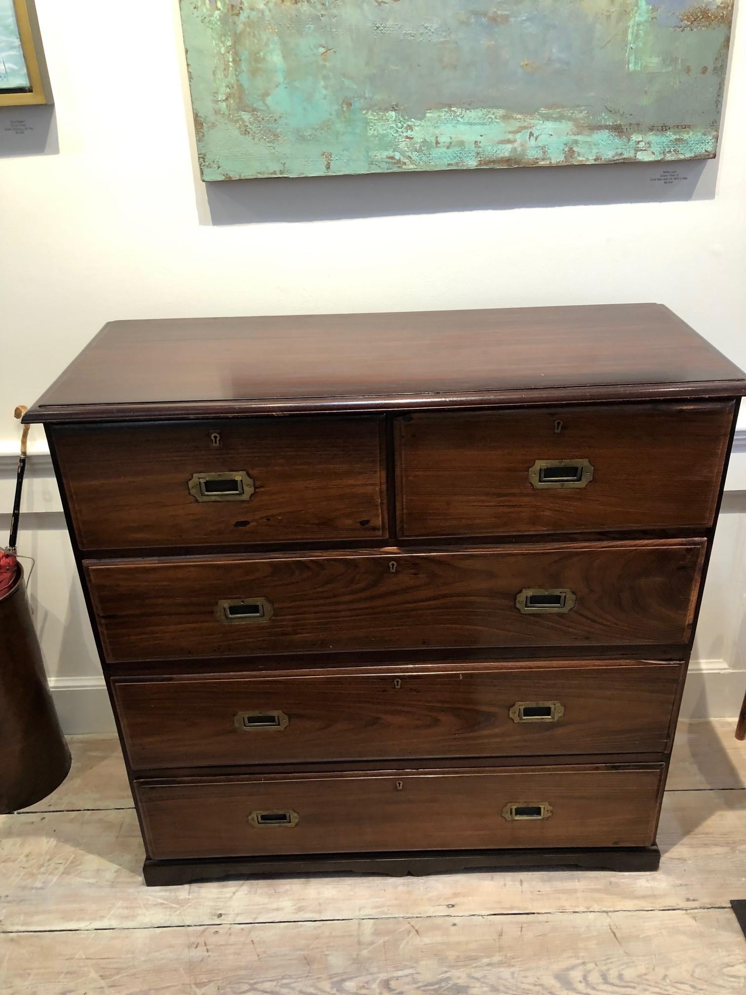British campaign chest of drawers in rosewood from the early 1900s. In classic campaign style, the chest is in two parts to allow for easier transportation complete with flush brass pulls. Secondary wood is also rosewood--a dense and exotic