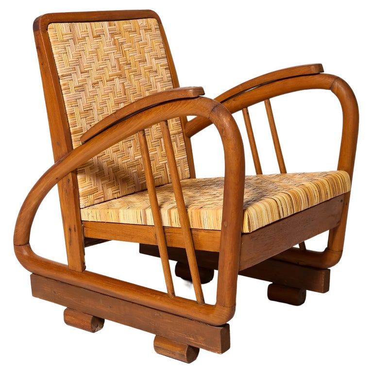 British Colonial Rattan fireside Chair at 1stDibs