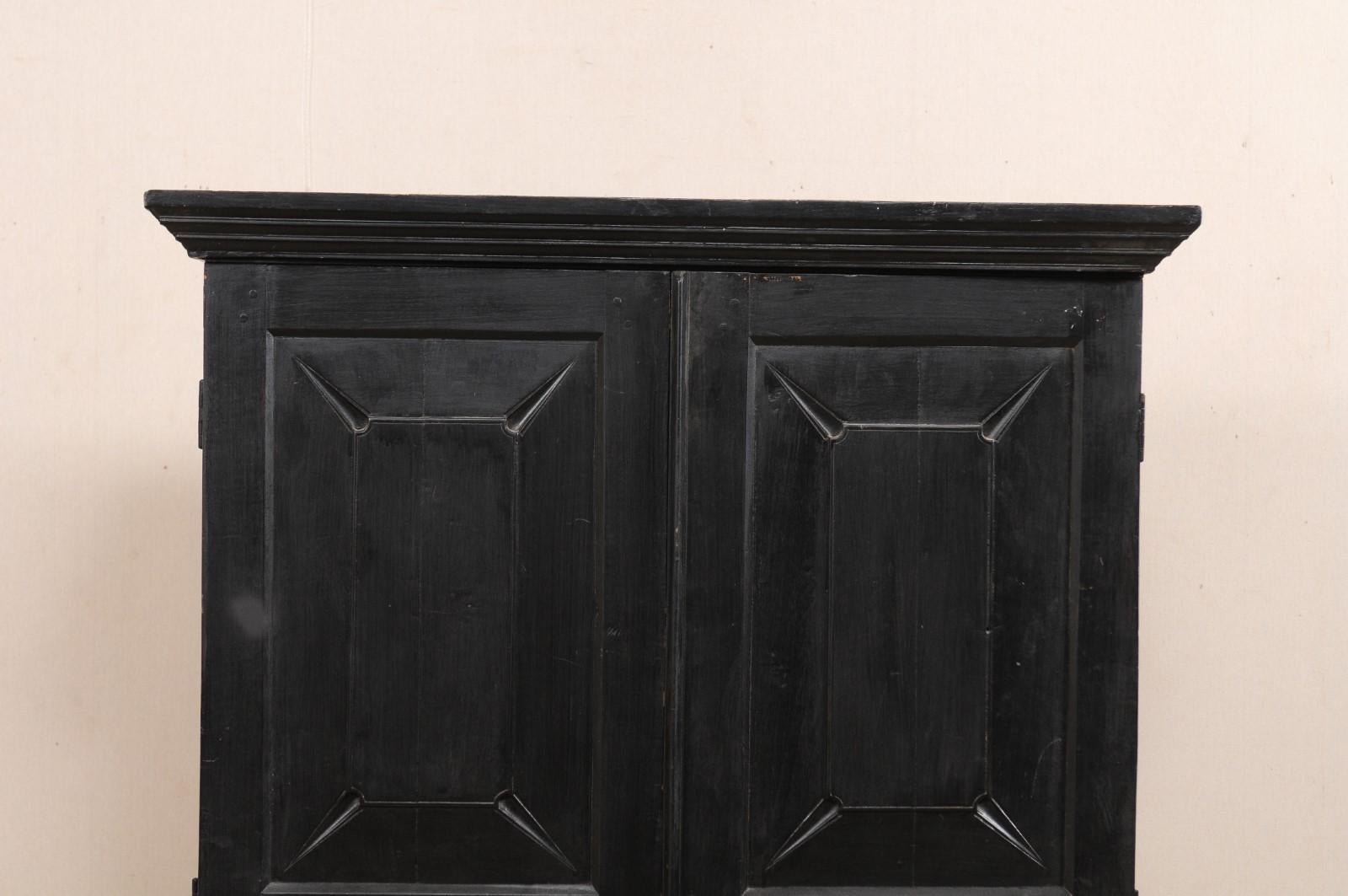 Carved British Colonial Cabinet from the Mid-20th Century in Rich Black Color