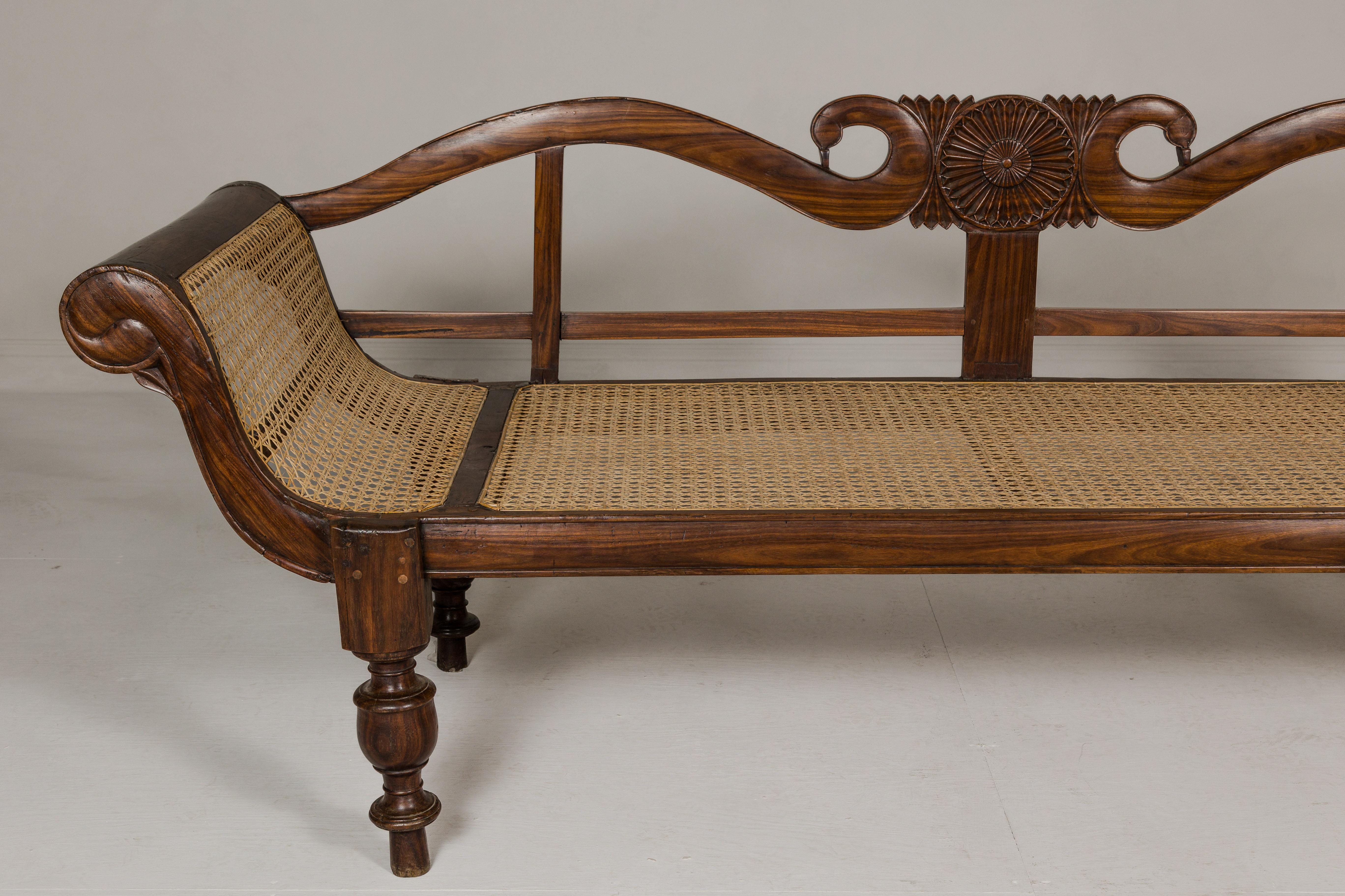 British Colonial Carved and Cane Settee with Swan Neck Back and Scrolling Arms In Good Condition For Sale In Yonkers, NY