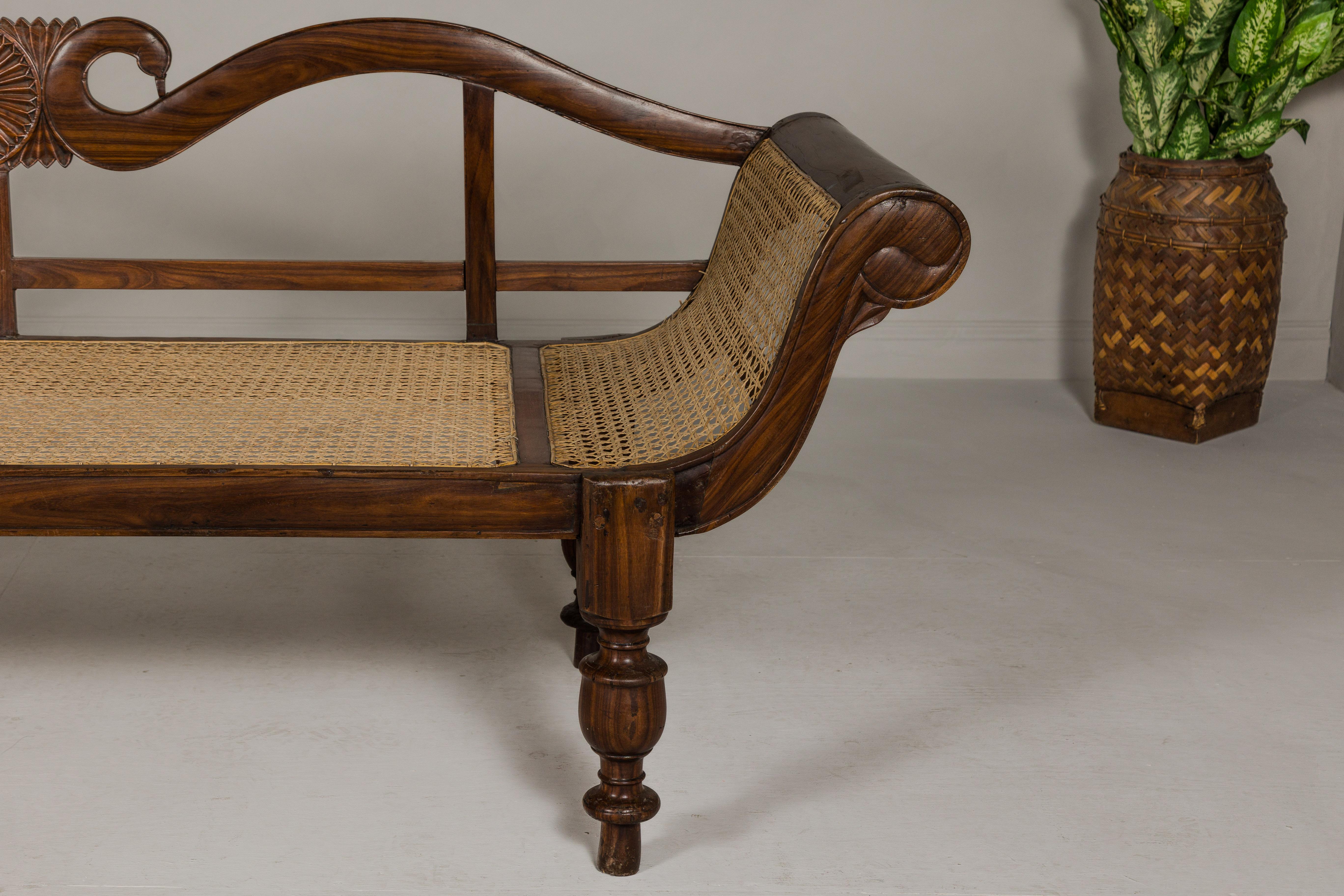 British Colonial Carved and Cane Settee with Swan Neck Back and Scrolling Arms For Sale 1