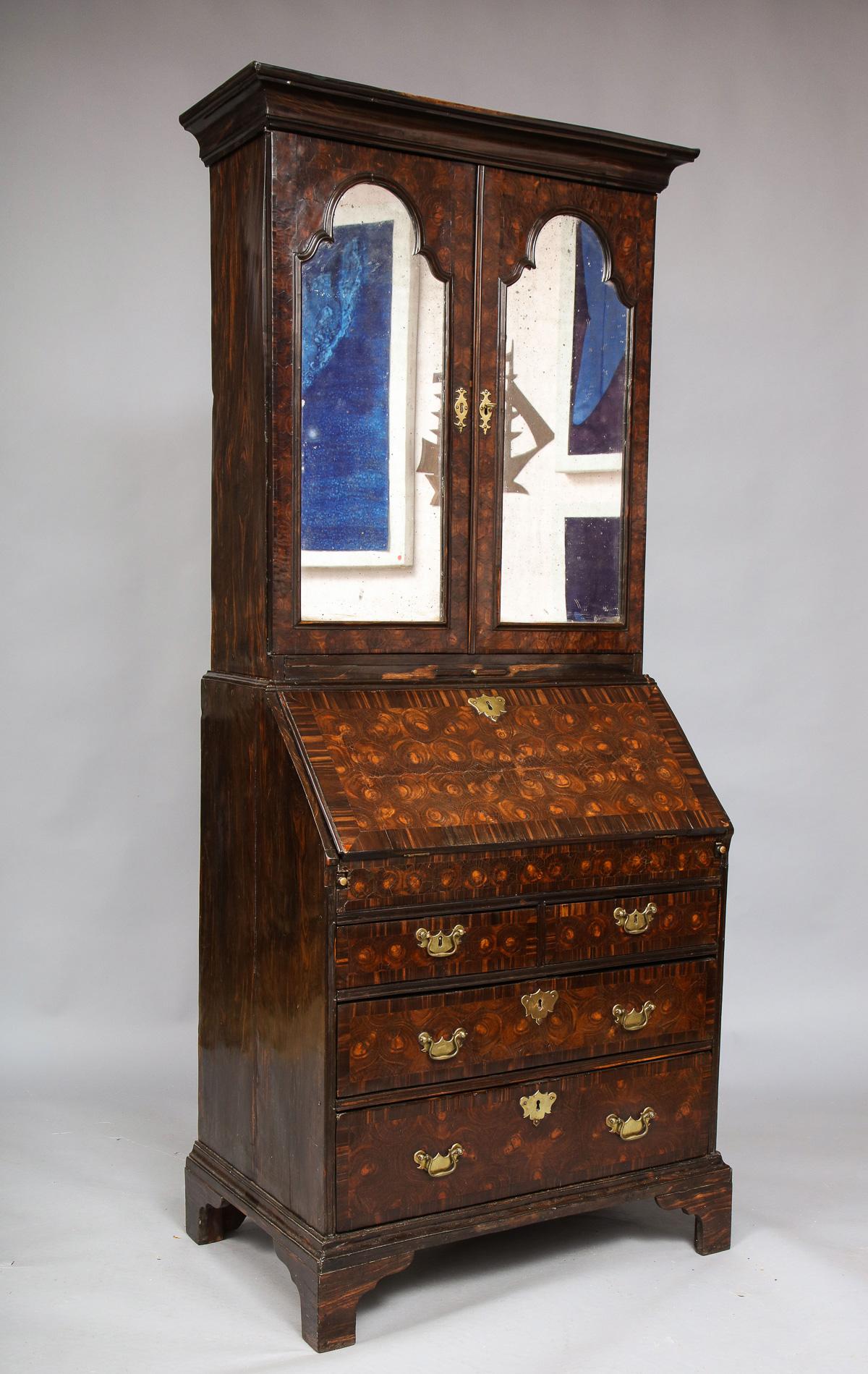 Exceedingly rare early 18th century English colonial Macassar ebony diminutive bureau bookcase with hexagonal oyster veneered doors, lids and drawer fronts, the sides and secondary timbers all in solid streaky ebony having rich patination, The upper