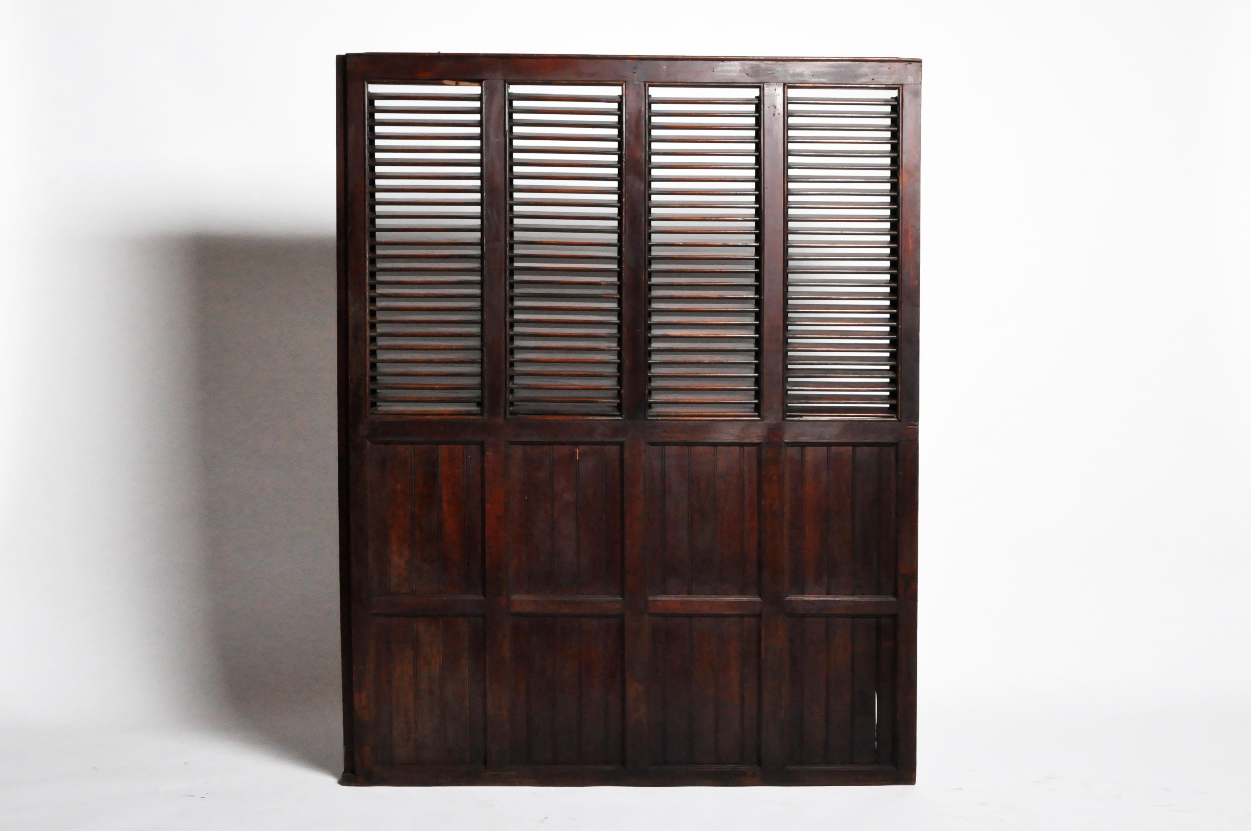 Teakwood, Rangoon, Burma, circa 1900. These louvers are fully operable and retain their original finish. The rich surface patina is natural. During the Colonial era (roughly 1850-1950), many veranda houses were built from Teakwood. As cities like