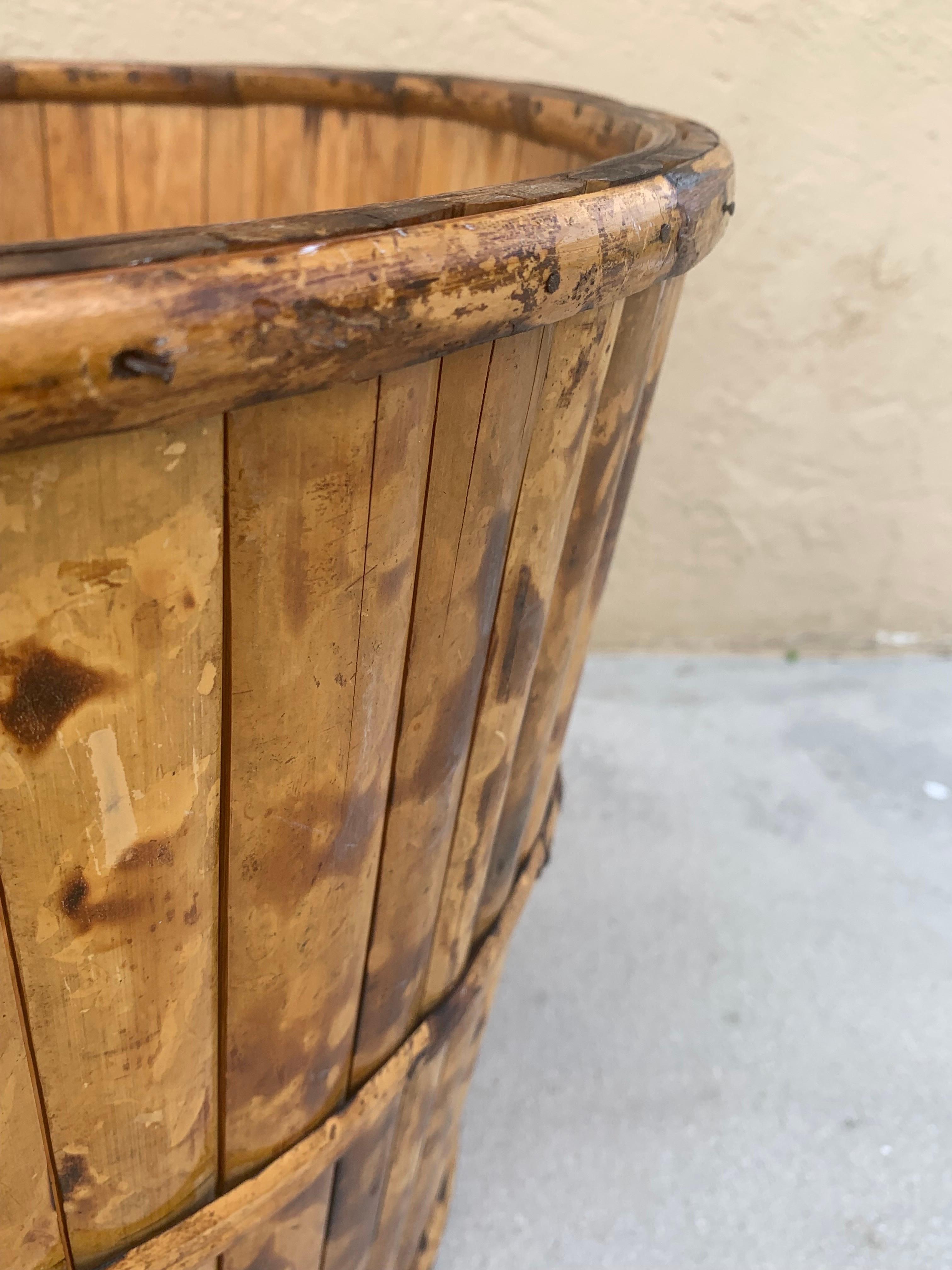 Vintage British Colonial style burnt bamboo planter. Made well and kept in great condition. Bamboo panels have been hand burnt to display a beautiful tortoiseshell pattern. 

Would look great in any room especially when paired with other natural