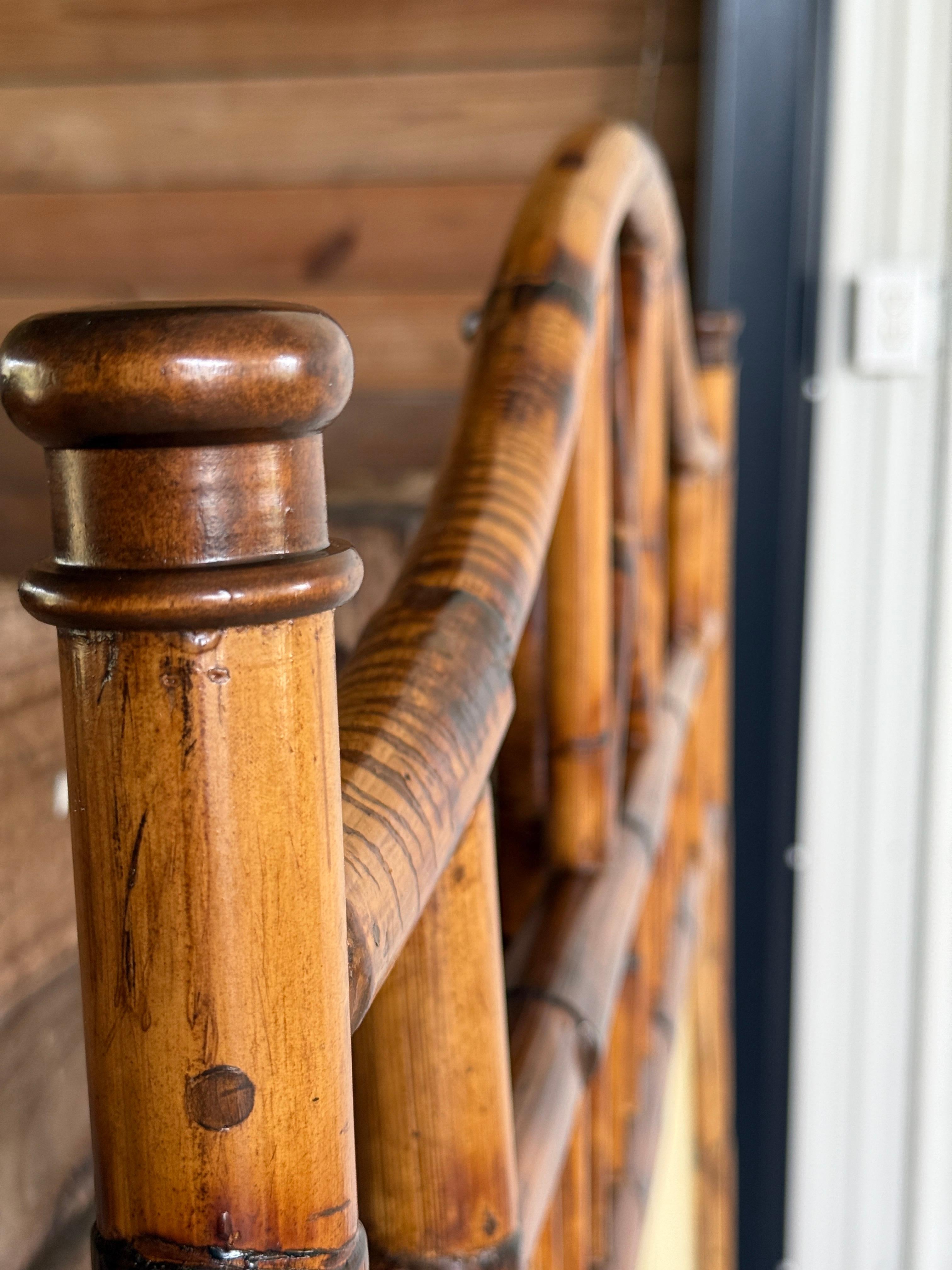 Presenting a charming pair of bamboo and rattan twin headboards, expertly refinished to restore their natural beauty while preserving their delightful tropical appeal. These headboards are more than just functional furnishings; they are exquisite
