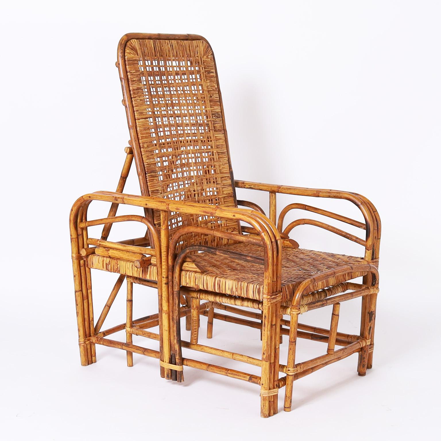 Mid century recliner chair crafted in bamboo and bent bamboo with caned seating featuring a pull out ottoman and Morris style reclining back.

Extended depth 75