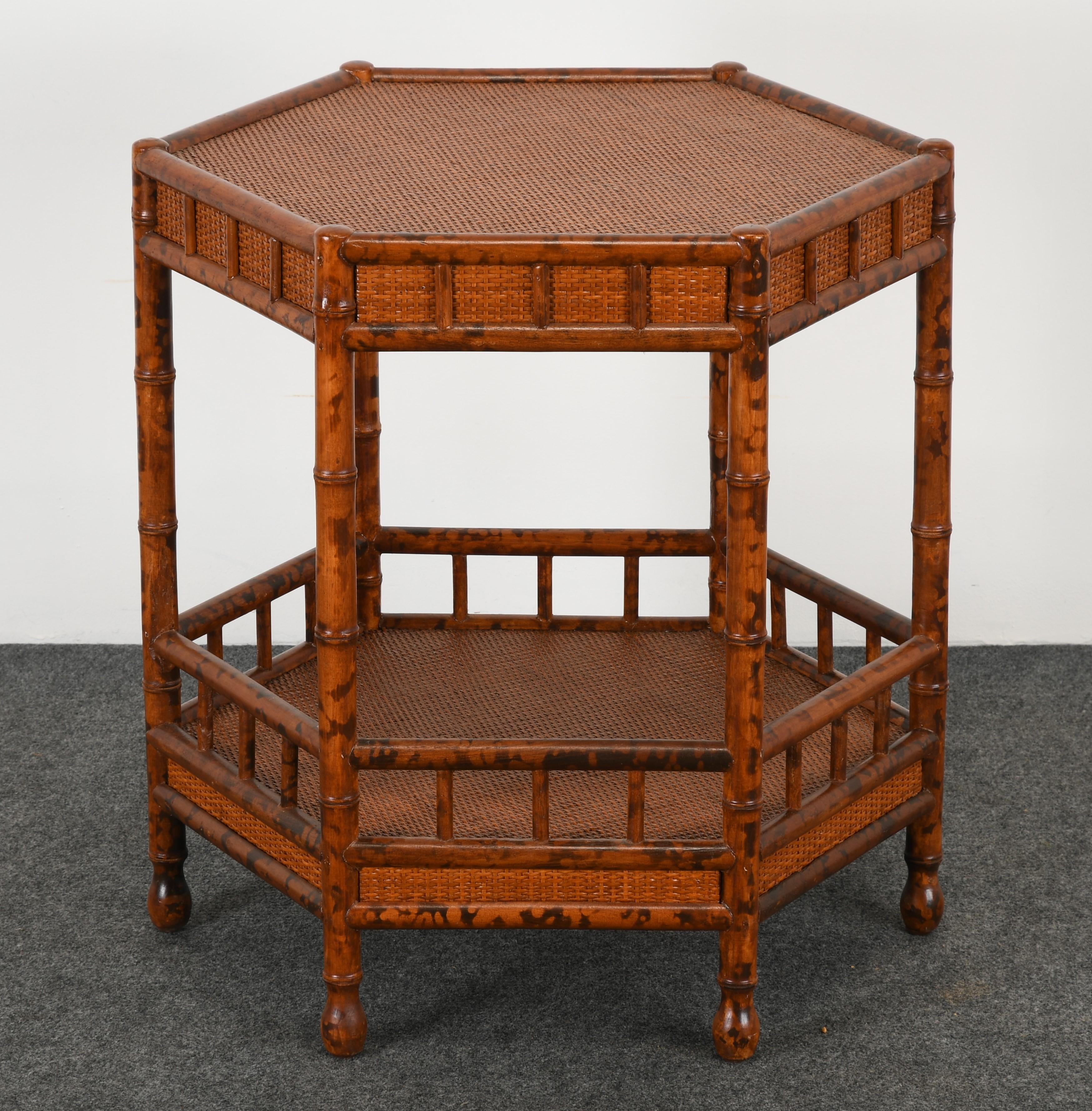 A fabulous British Colonial style faux bamboo and grasscloth occasional table. This table was made exclusively for Bloomingdale's in the 1970s. The table could be used as a nightstand or end table. It is structurally sound and in good condition with