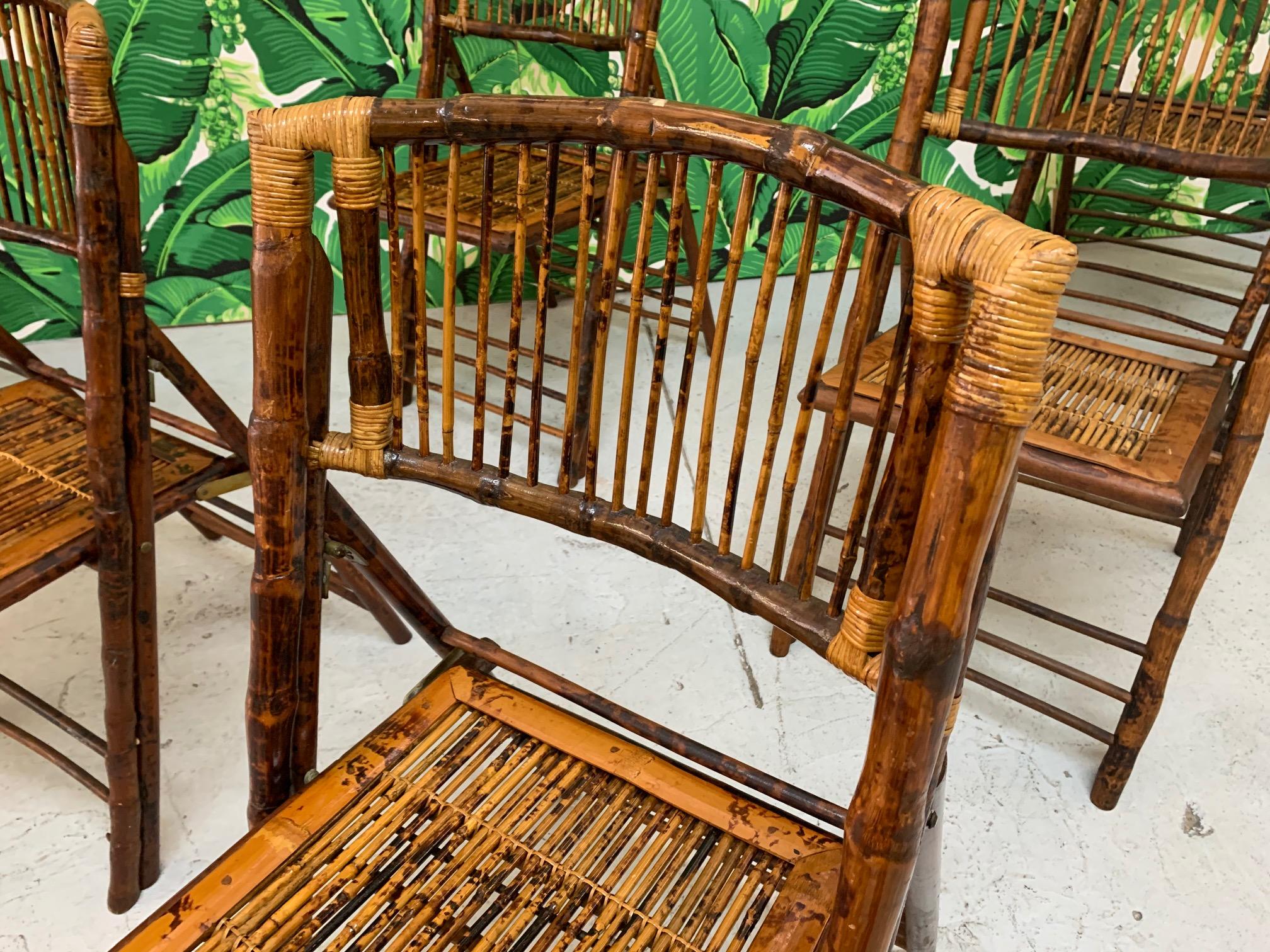 Set of 6 bamboo safari chairs feature tiger wood design and folding frame for easy storage. Perfect for a garden party or for interior use as well. Good vintage condition with minor imperfections consistent with age. Price is for the set.
