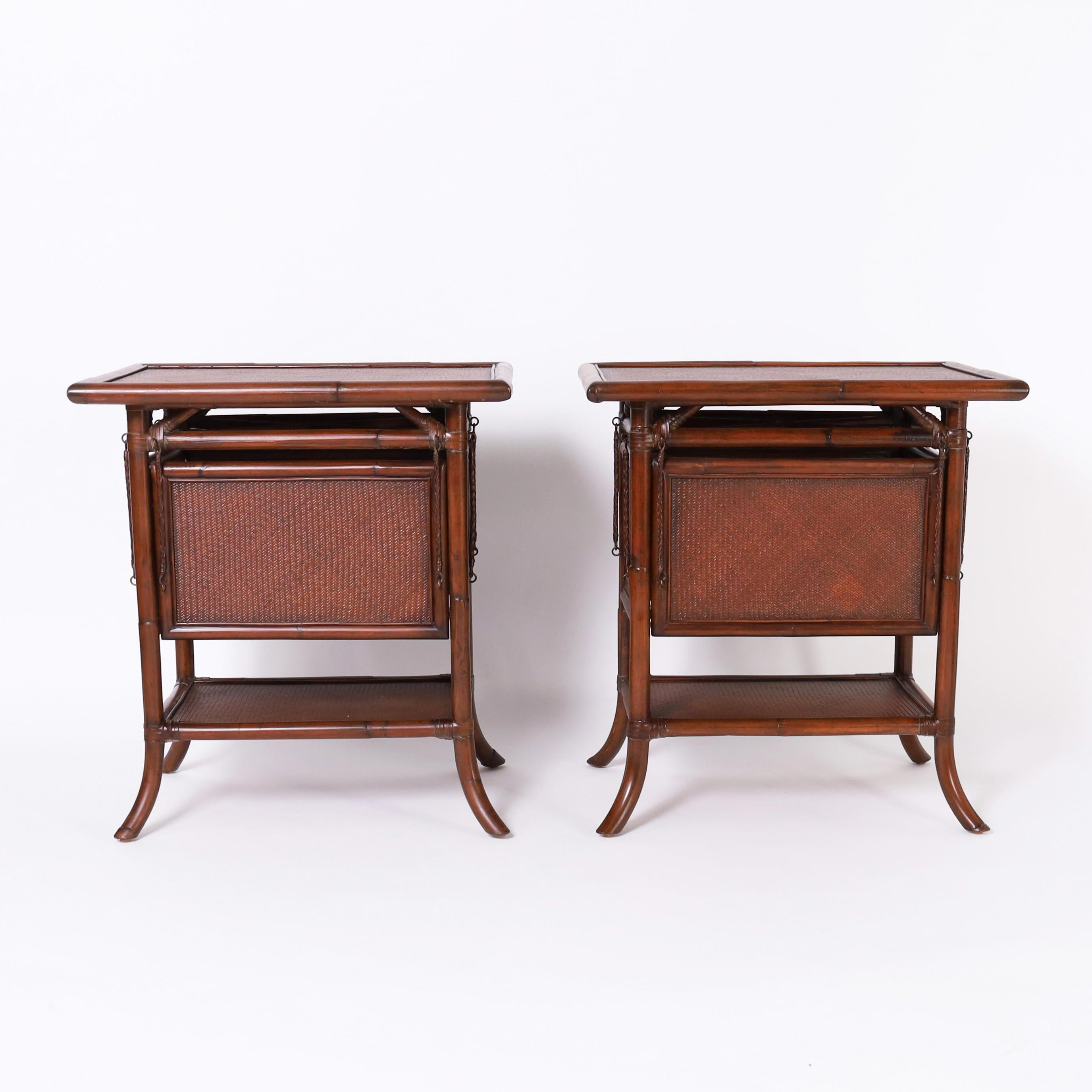 Impressive pair of mid century stands crafted in grasscloth and bamboo with four transforming foldout trays or surfaces, can be used with one, two, three, or all four.

Open dimensions- H: 28 W: 40 D: 34