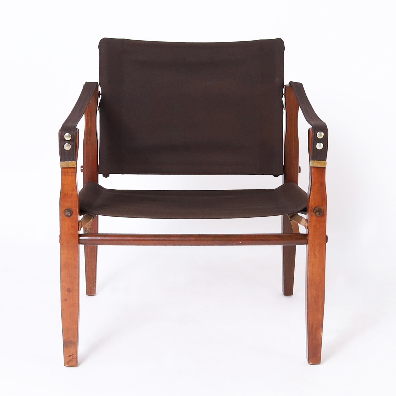 Stained British Colonial Style Set of Four Safari Chairs For Sale