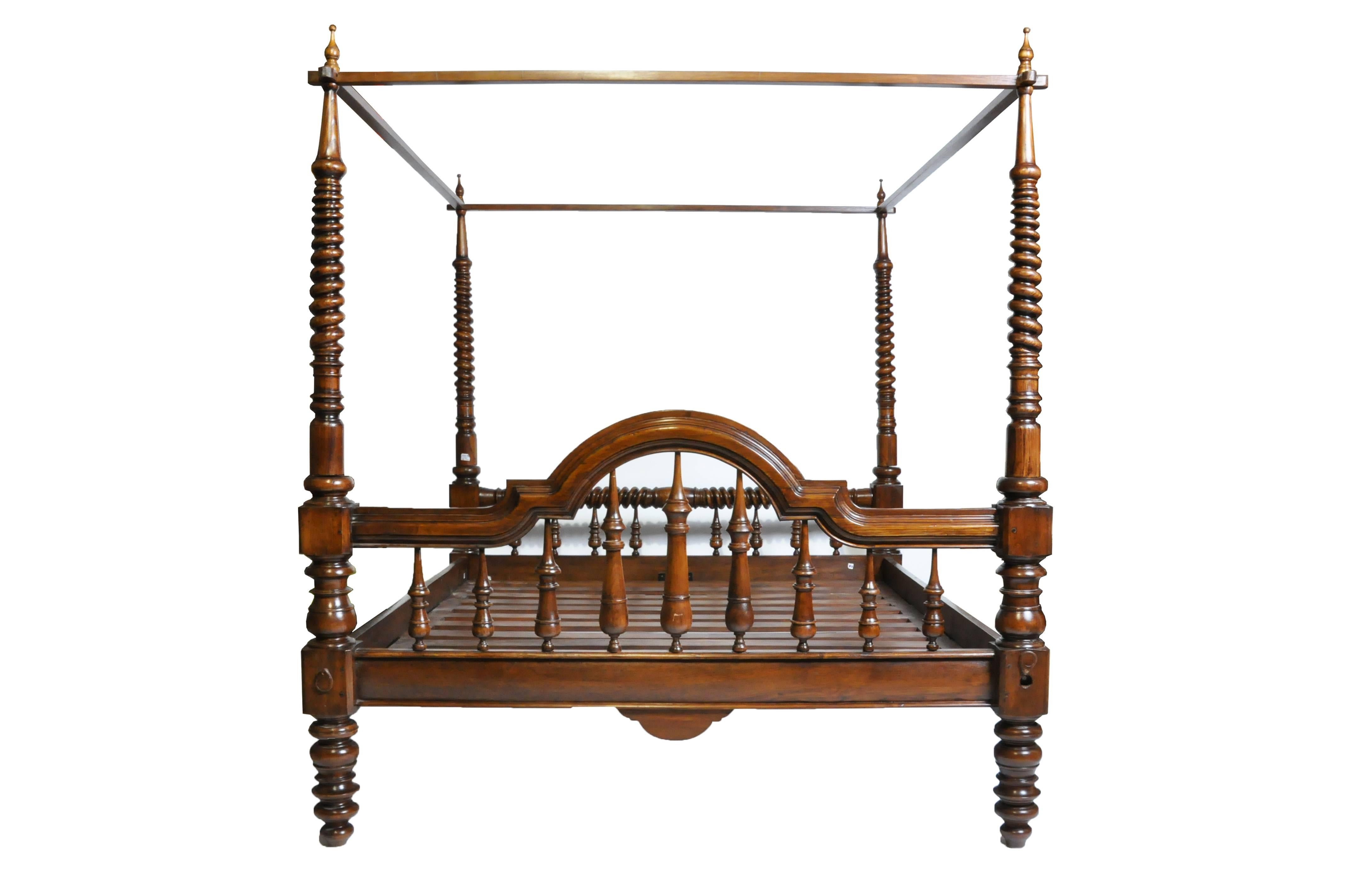 This impressive British Colonial bed is from Chiang Mai, Thailand and was made from teak wood, circa 1900. The bed features beautiful hand-carved work, posts for a canopy, and the teak wood is strong and sturdy ideal for any types of climates; teak
