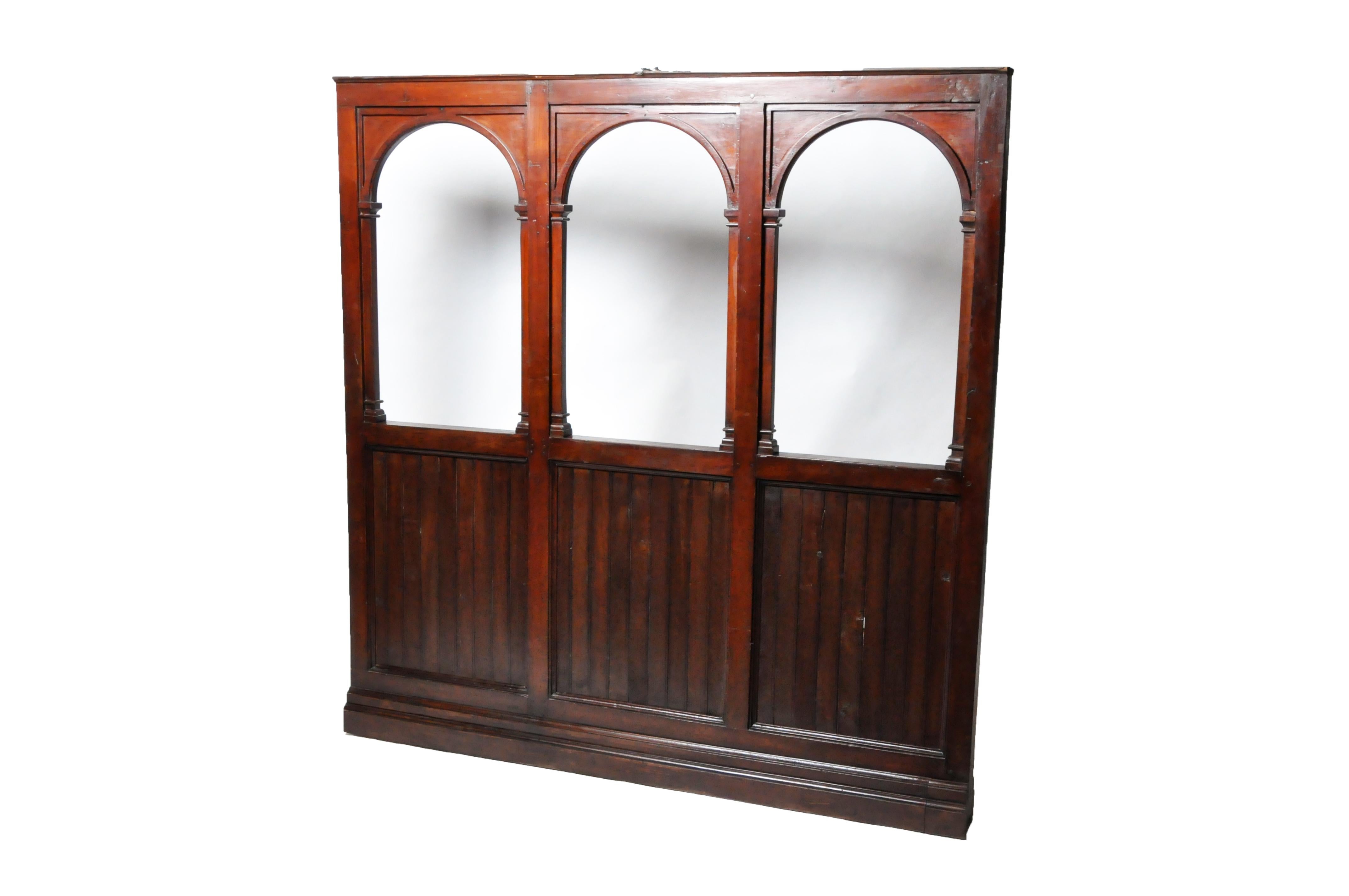 This arched teak wall was once part of the interior architecture of a Burmese veranda house. These large and elegant structures were built in the colonial cities of Rangoon and Mandalay during the 19th and 20th centuries. Veranda houses usually had