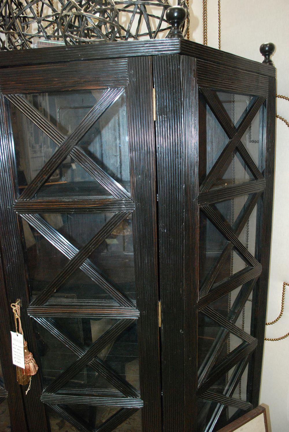 Cabinet, Display X-Design w/2 Glass Doors Repro

A handsome reproduction piece of a British Colonial rosewood X-design display cabinet. The cabinet features intricately carved detailed characteristics with finials at top.