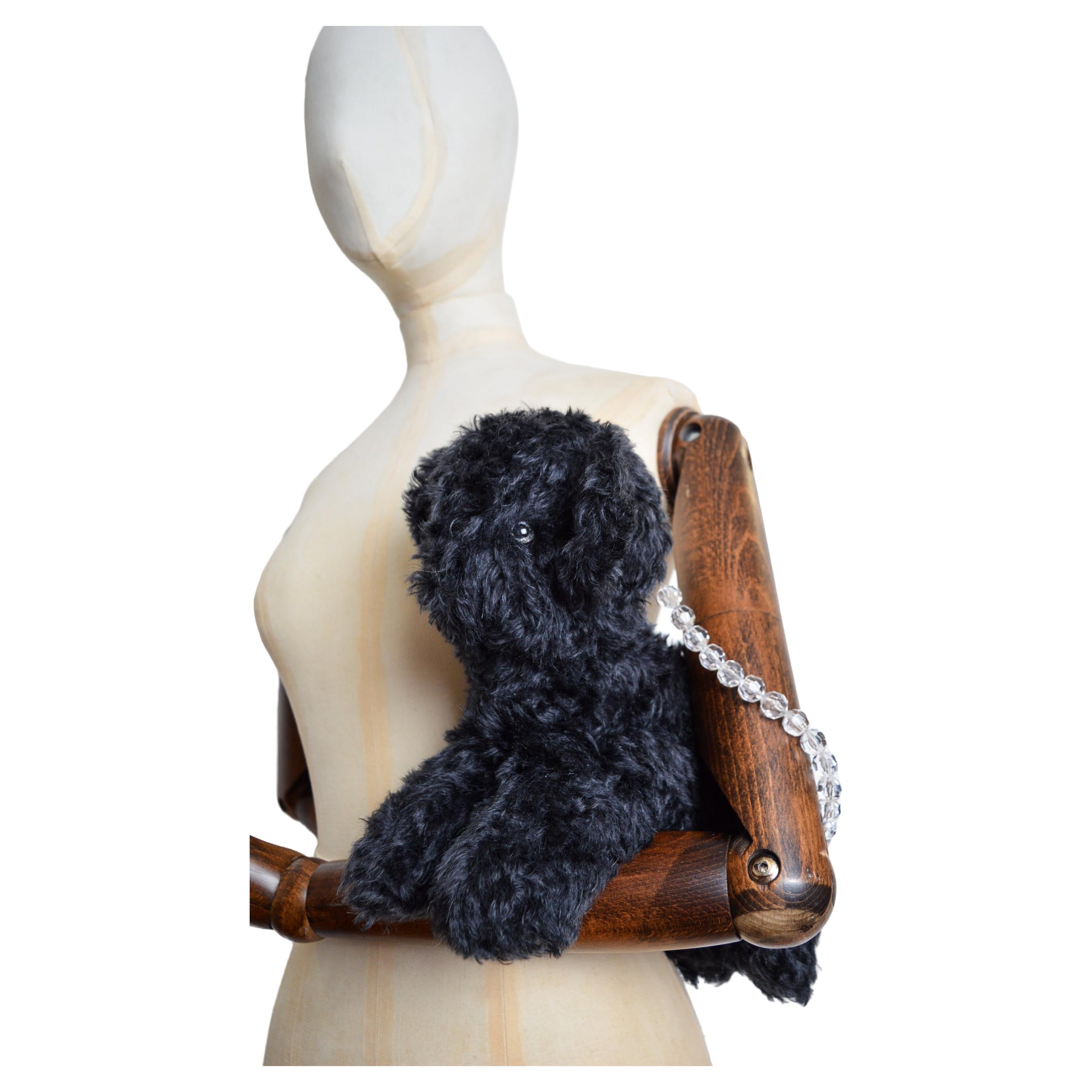 A fun Teddy bear Shaped 'Claudia' Mohair bag by British Designer 'ASHLEY WILLIAMS'

MADE IN ENGLAND.  

Features ; Beaded top handles, Bendable limbs and Tail, Cute Sparkly eyes and Nose, Zip fasten closure, Single Interior compartment (Fits and