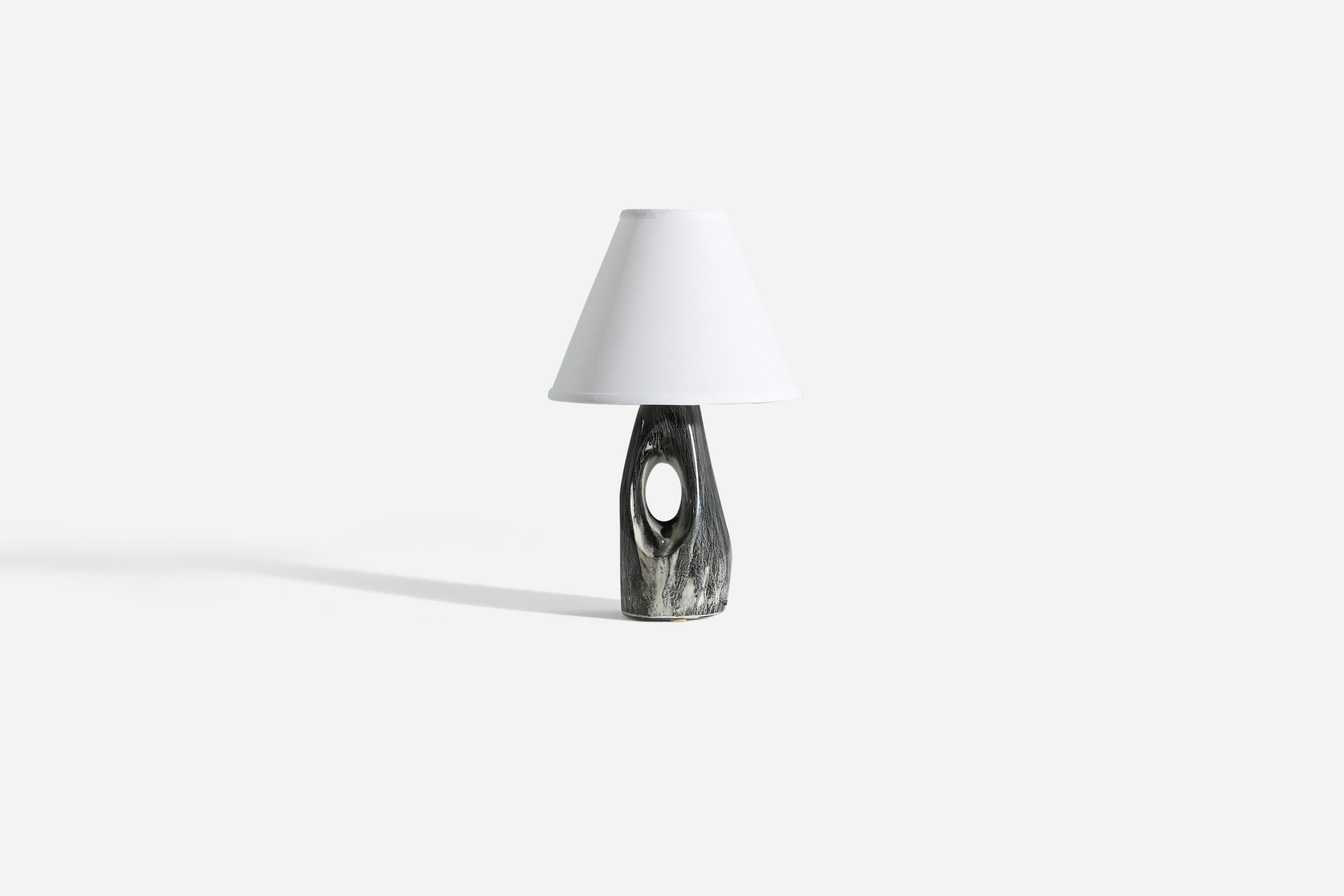 A ceramic table lamp, designed and produced by a British designer, United Kingdom, 1960s.

Glaze features a grey color with hints of white.

Sold without lampshade. 
Dimensions of Lamp (inches) : 12.25 x 4.0625 x 4 (H x W x D)
Dimensions Shade