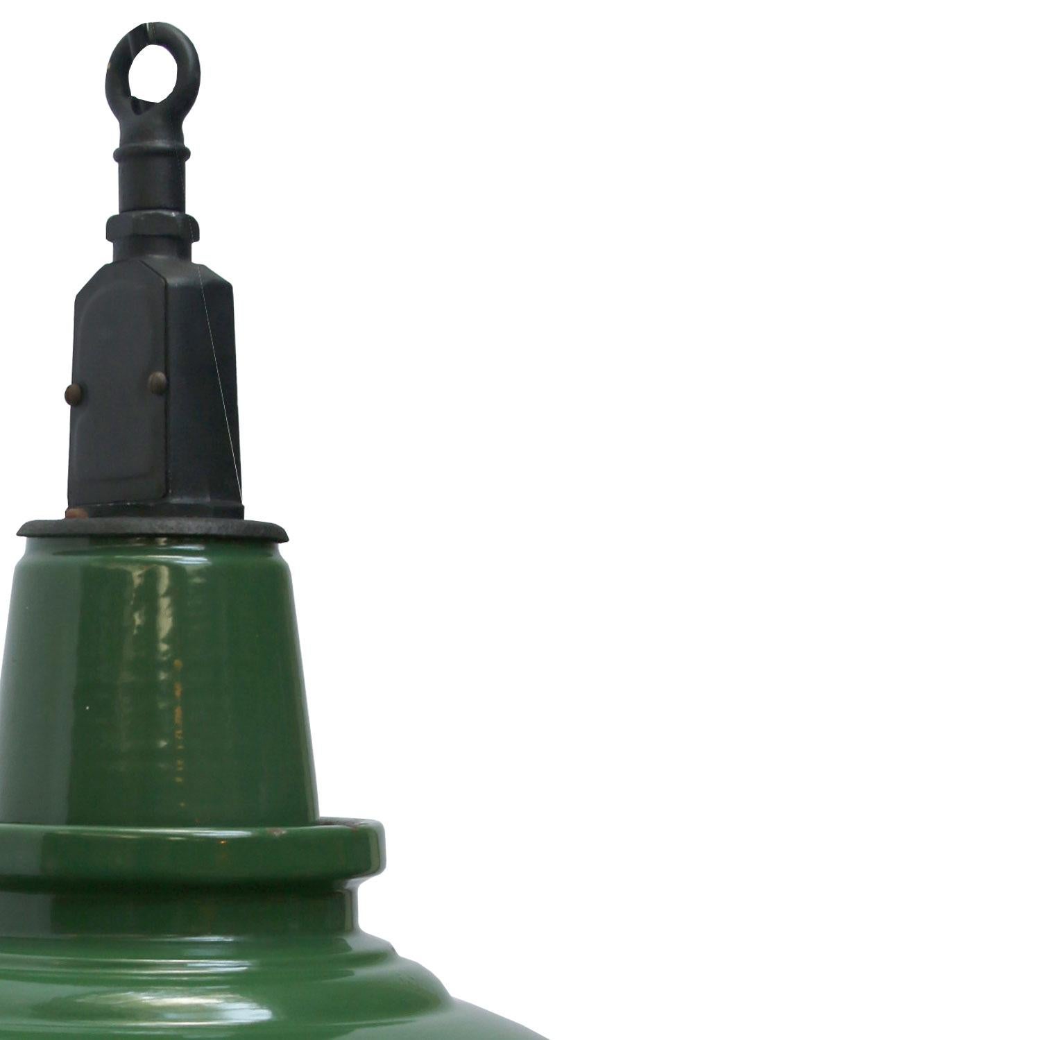 British vintage industrial hanging pendant. Green enamel with white interior. Metal top. 

Weight: 3.2 kg / 7.1 lb

Priced per individual item. All lamps have been made suitable by international standards for incandescent light bulbs,