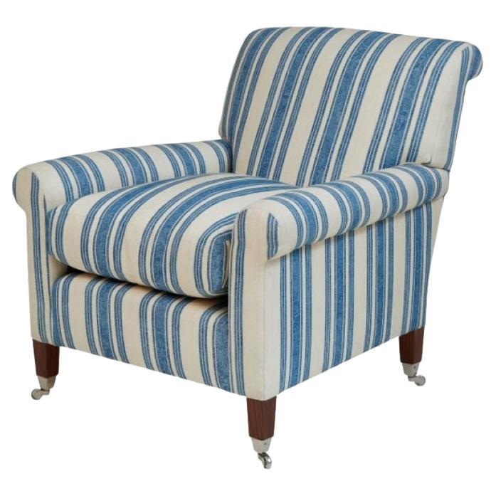 Fixed back armchair made in traditional upholstery workshop in London For Sale