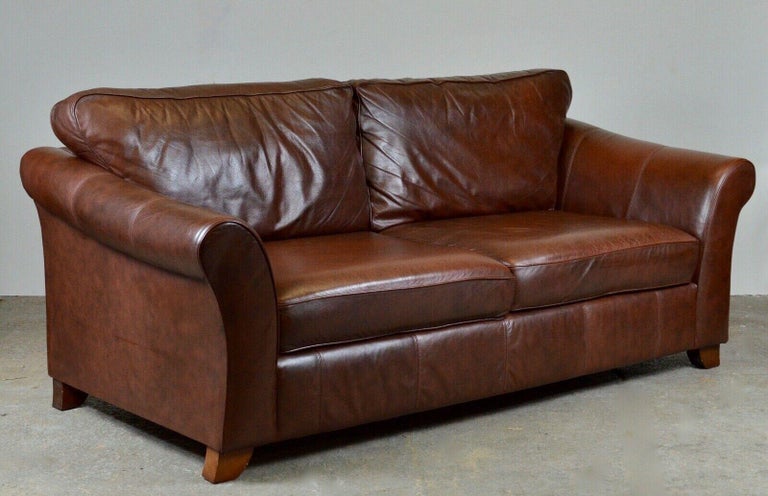 We are delighted to offer for sale this beautiful Marks & Spencers Abbey large 3-seater brown leather sofa. It features a smooth high back and seat cushions which provide ultimate comfort. It will have normal patina throughout and is in good