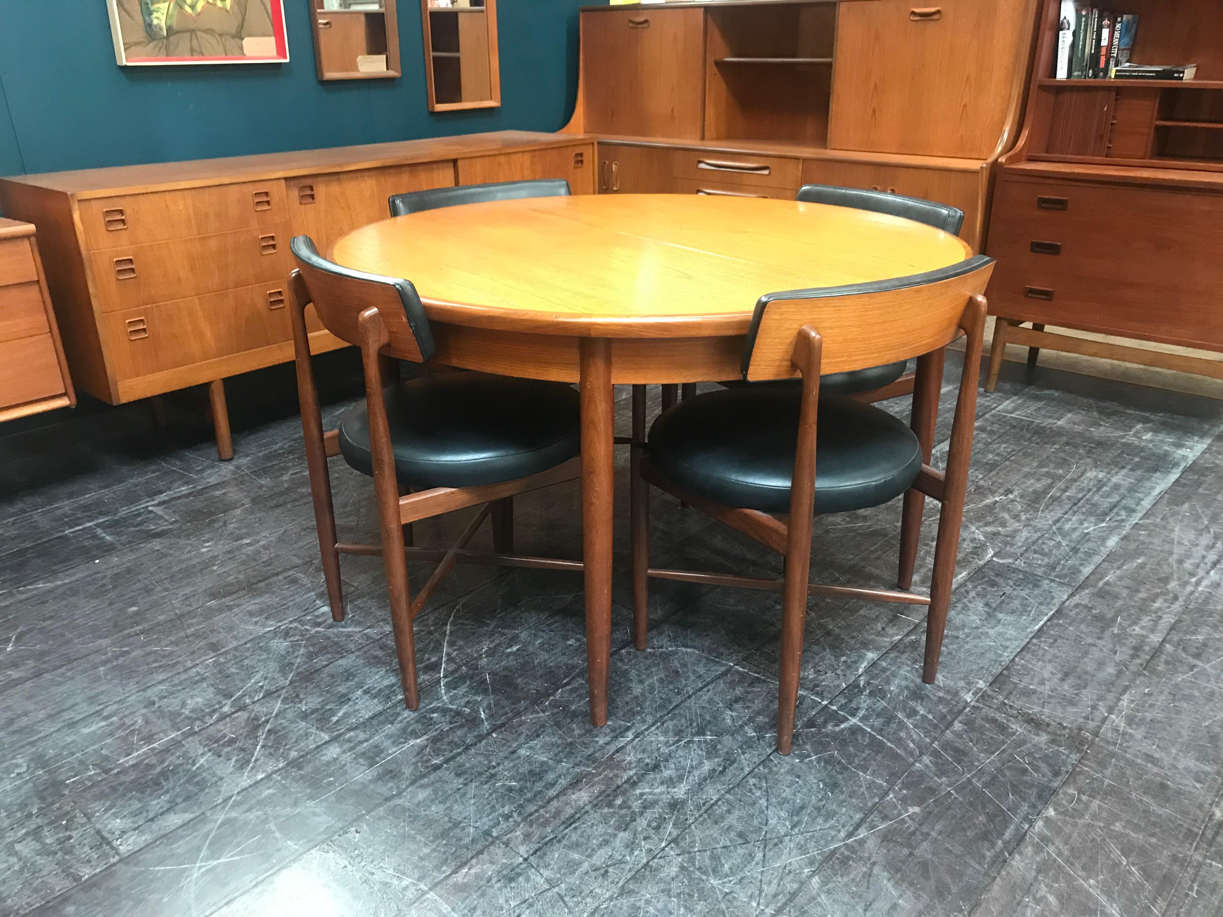 This table and chairs show a distinct Danish influence, typical of the period. This Classic midcentury dining table extends to accommodate 6 people if required. A beautifully designed & crafted extending dining table, this vintage item has that