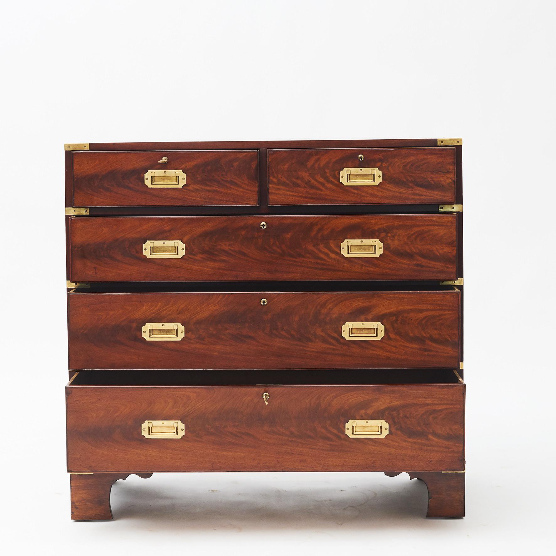 A fine English military officer’s Campaign chest. Flame mahogany with a beautiful grain.
Two short drawers over three long drawers sitting on bracket feet. Accented with original brass hardware and carrying handles. Key of later date.
England