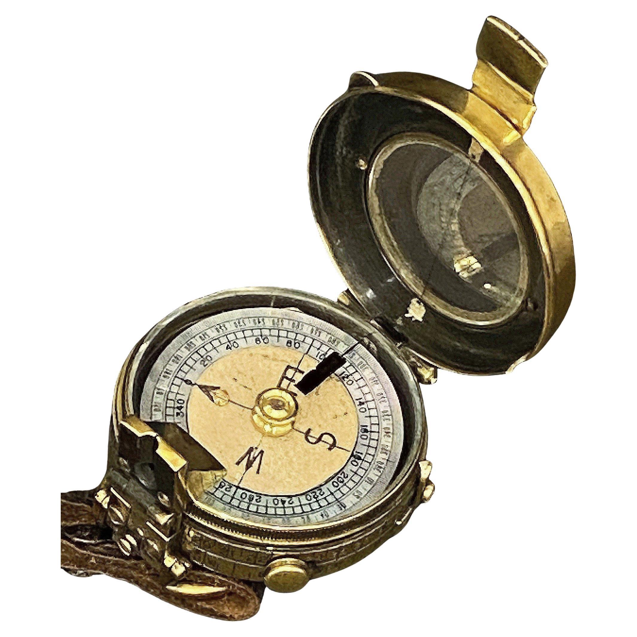 A working British military officer's Marconi marching or sighting compass of heavy brass from World War I.
Featuring a brass case and mounted with a lanyard ring. The glass face and numbered brass outer ring are perfectly intact. 

A handsome piece