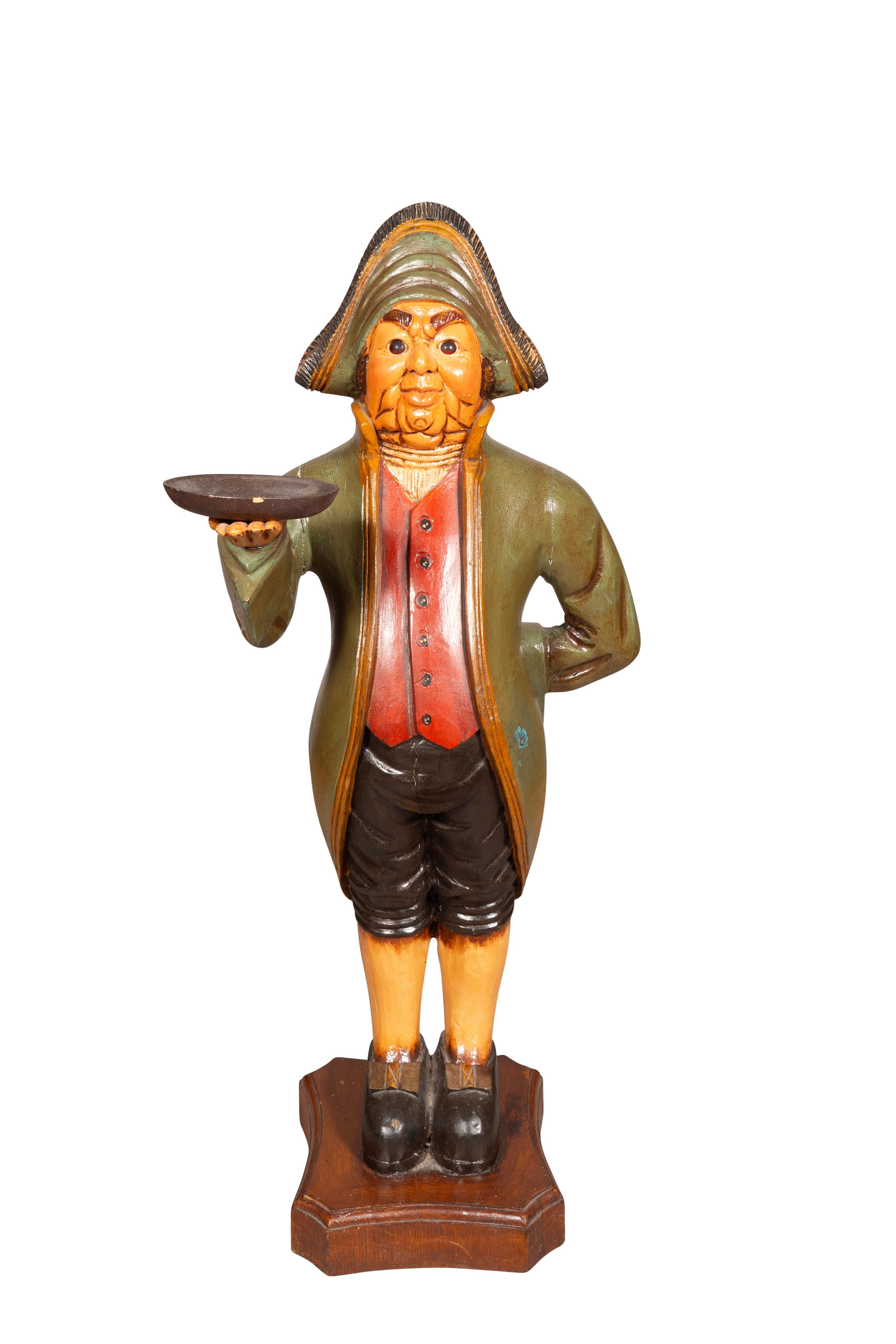 Humorous well carved fellow standing holding a shallow bowl possibly for calling cards. Estate of the founder of Yankee Candle Company.