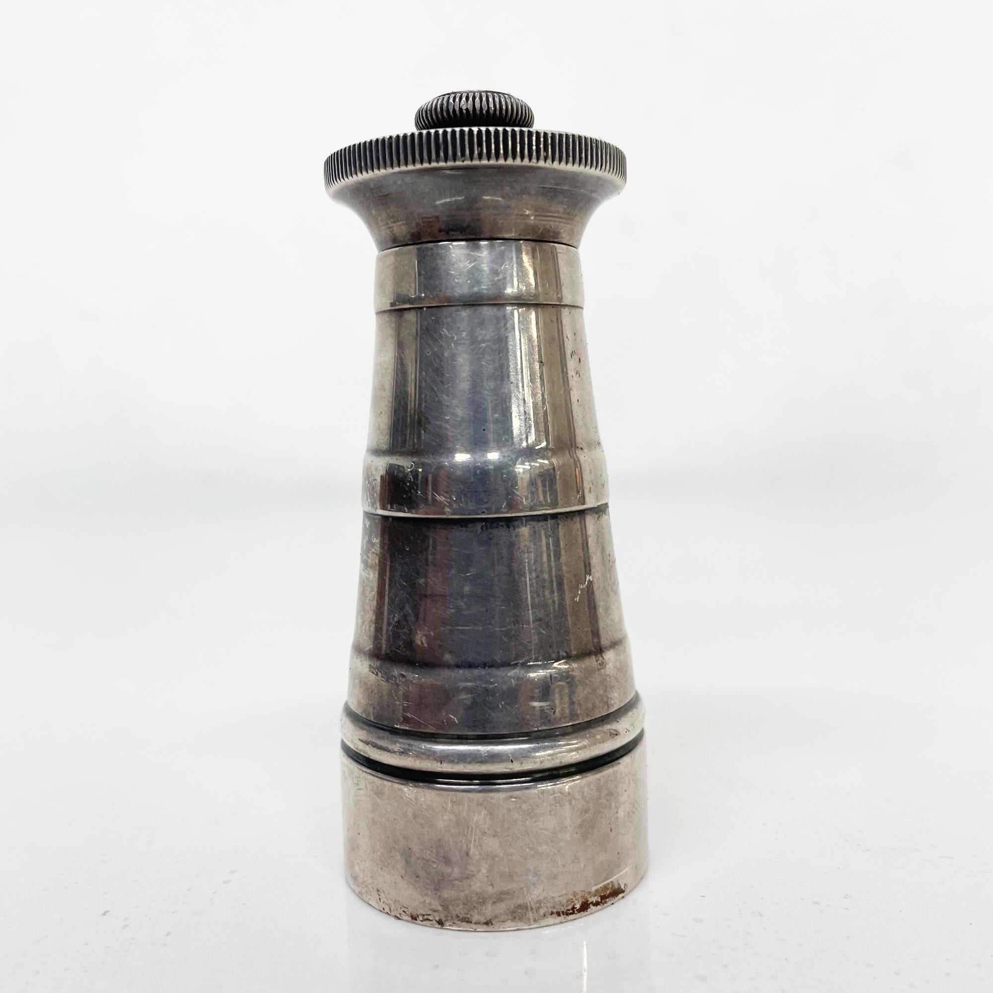 Striking Modernism by British PARK GREEN & CO LTD pepper Mill Grinder
Appears as silver plated
Made in England by Parker & Green co LTD3.25 tall x 1.63 in diameter inches
Original unrestored vintage condition. Tested and working. 
Review