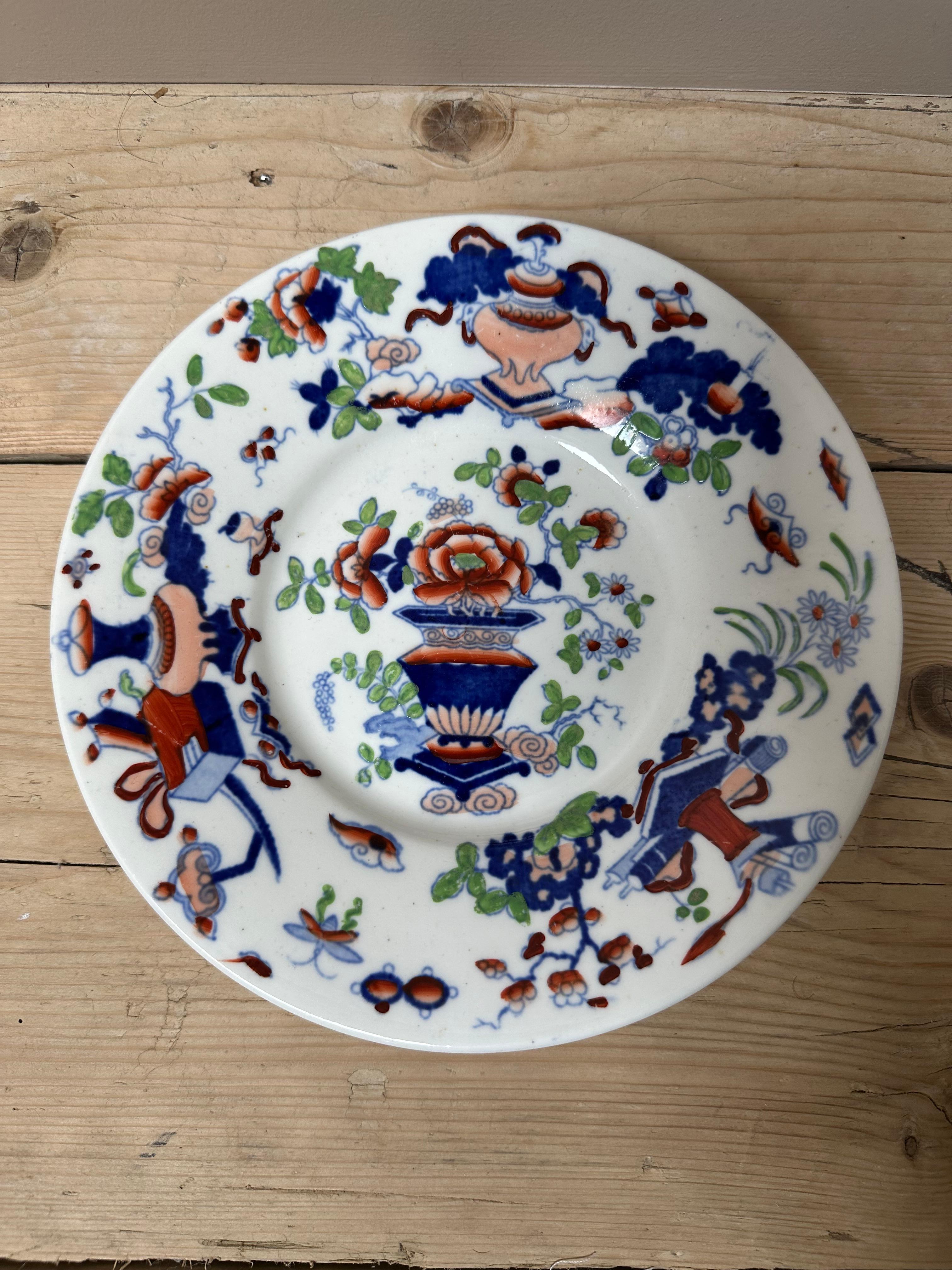 The image shows an English porcelain plate, likely dating to the early 19th century, featuring a Chinoiserie design characteristic of the Hilditch factory. 
Type: English porcelain plate.
Maker: Attributed to Hilditch & Son, based on the Chinoiserie
