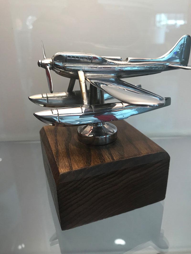 Chromium- plated on brass, the inscription Rolls Royce embossed beneath the right float, circa 1940. Mounted on a wooden base, 12 cms long.

The Supermarine S.6B is a British racing seaplane developed by R.J. Mitchell for the Supermarine Company