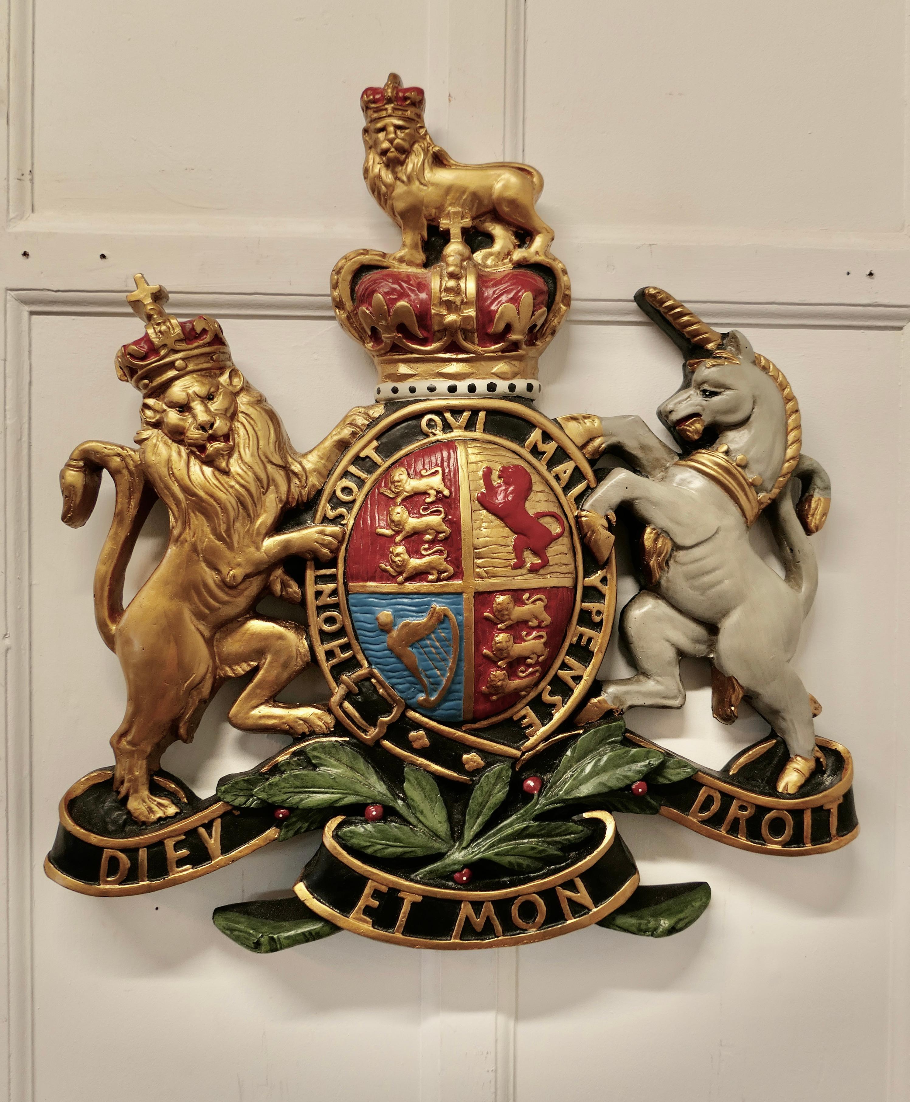 British royal coat of arms wall plaque

This is a large scale piece, it dates from the 1950s and is made in plaster and it is painted in very bright colours,

The plaque has metal fixings set into it at the back so it can be wall hung without