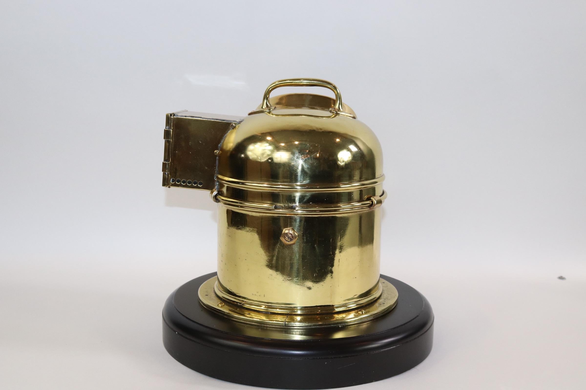 Solid brass ships binnacle built to pattern 183 with gimbaled compass, mounted to a thick mahogany base. Brass is highly polished and lacquered. Weight is 23 pounds.