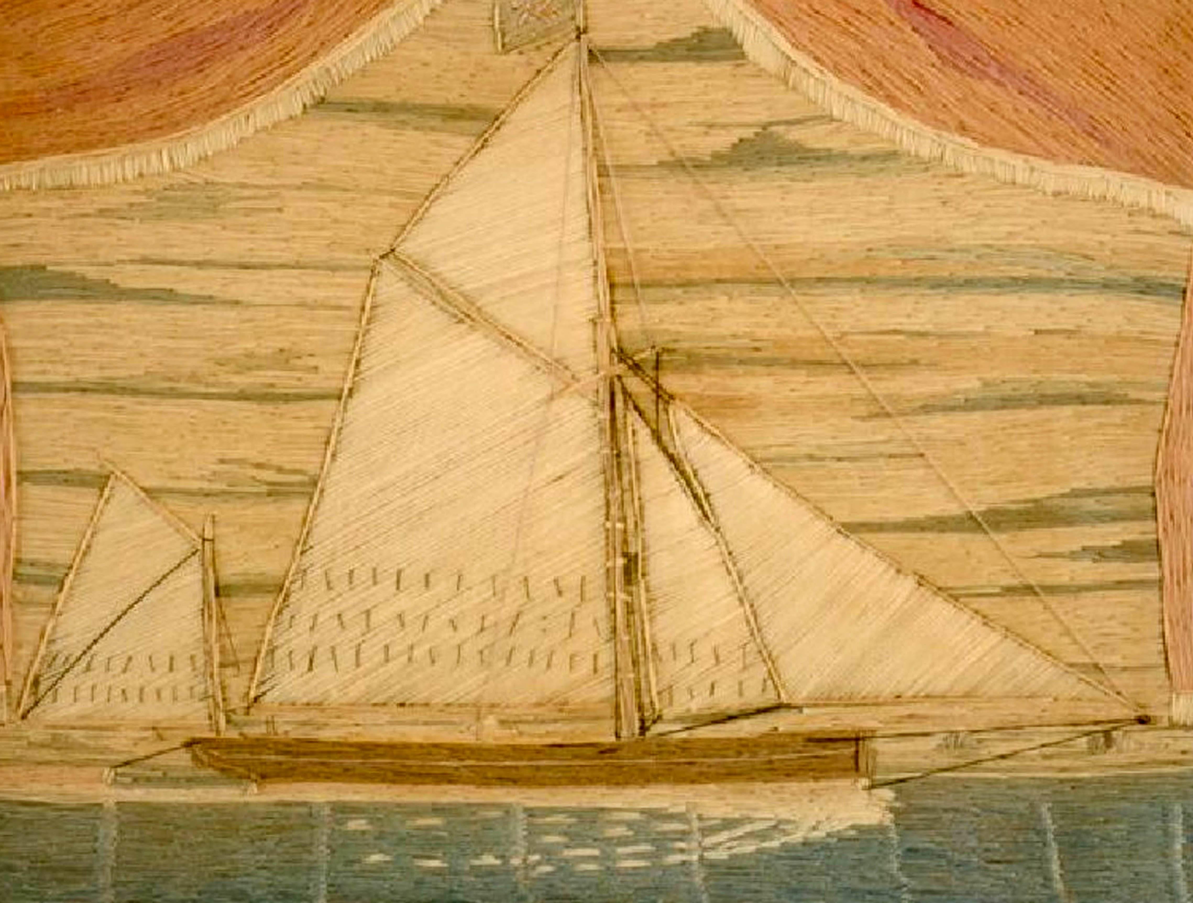 British sailor's woolwork of a bowsprit Thames barge,
circa 1870.

Charming small sailor's woolie of a double-masted ship within maple frame. The ship is most likely a Thames bowsprit barge. The ship is depicted framed below and between red