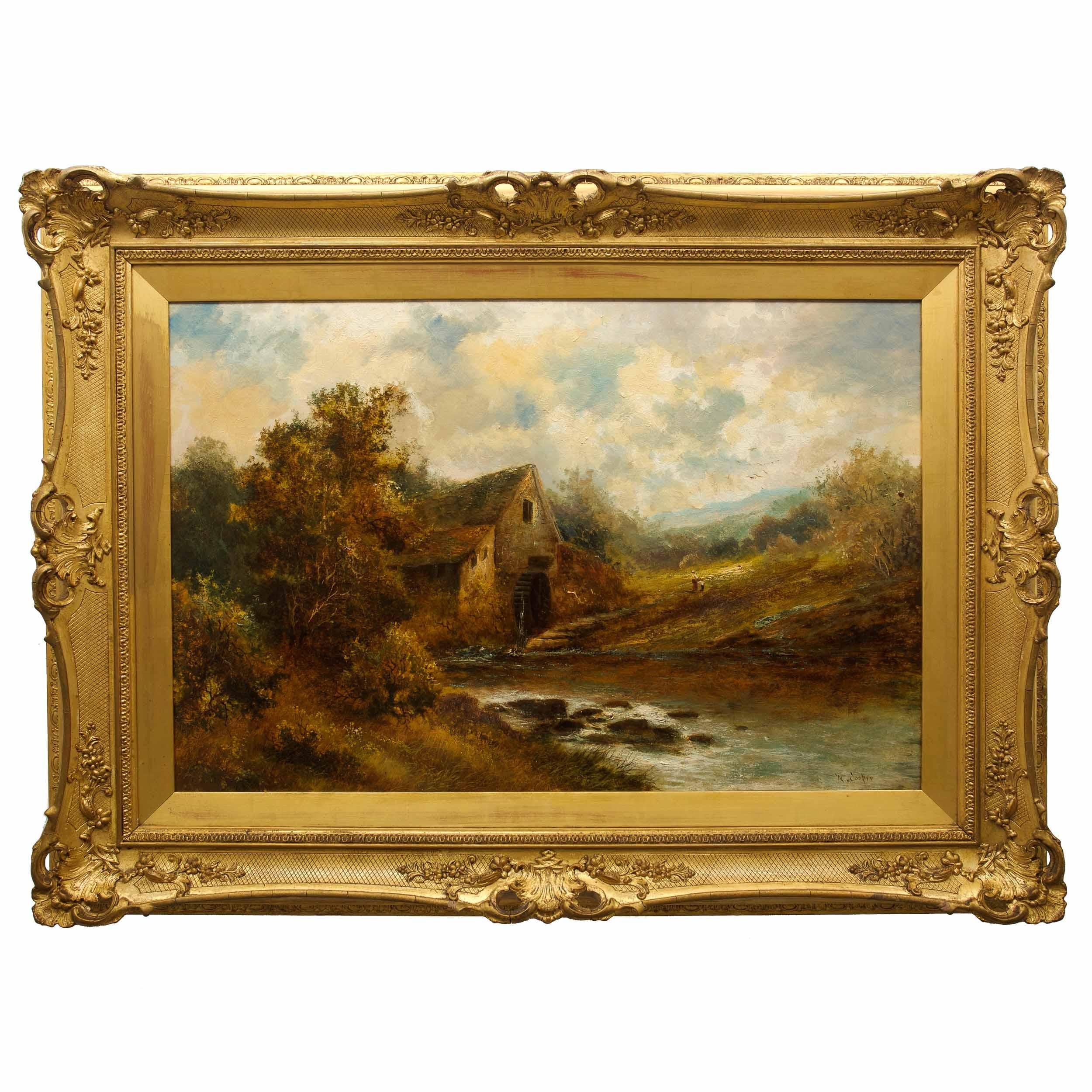 A superb late 19th century landscape scene depicting the rural English countryside under a heavy sky thick with clouds that capture the warmth of the sunlight and diffuse golden rays across the fall foliage of the extensive tree coverage below. The