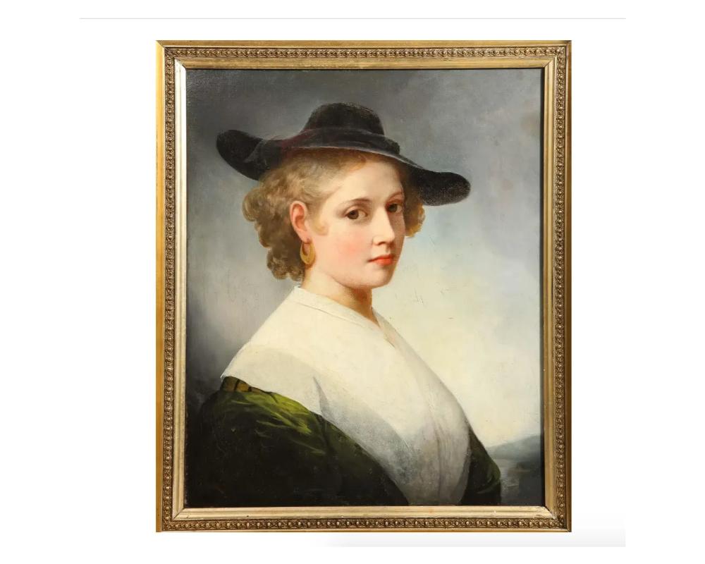 (British School, C. 1840) An Exceptional Quality Portrait “Lady in Green”

Oil on canvas painting.

Exceptional 19th century. portrait of a young lady, in a brimmed black hat, with gold earrings, and a green dress with a broad white collar, in a