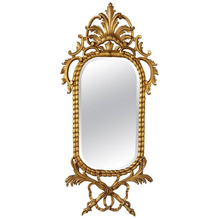 British stately homes Georgian style mirror. Antique gold metal leaf finish
Resin and wood made in late 1980s at Stephen Cavallo
Overall size H. 63