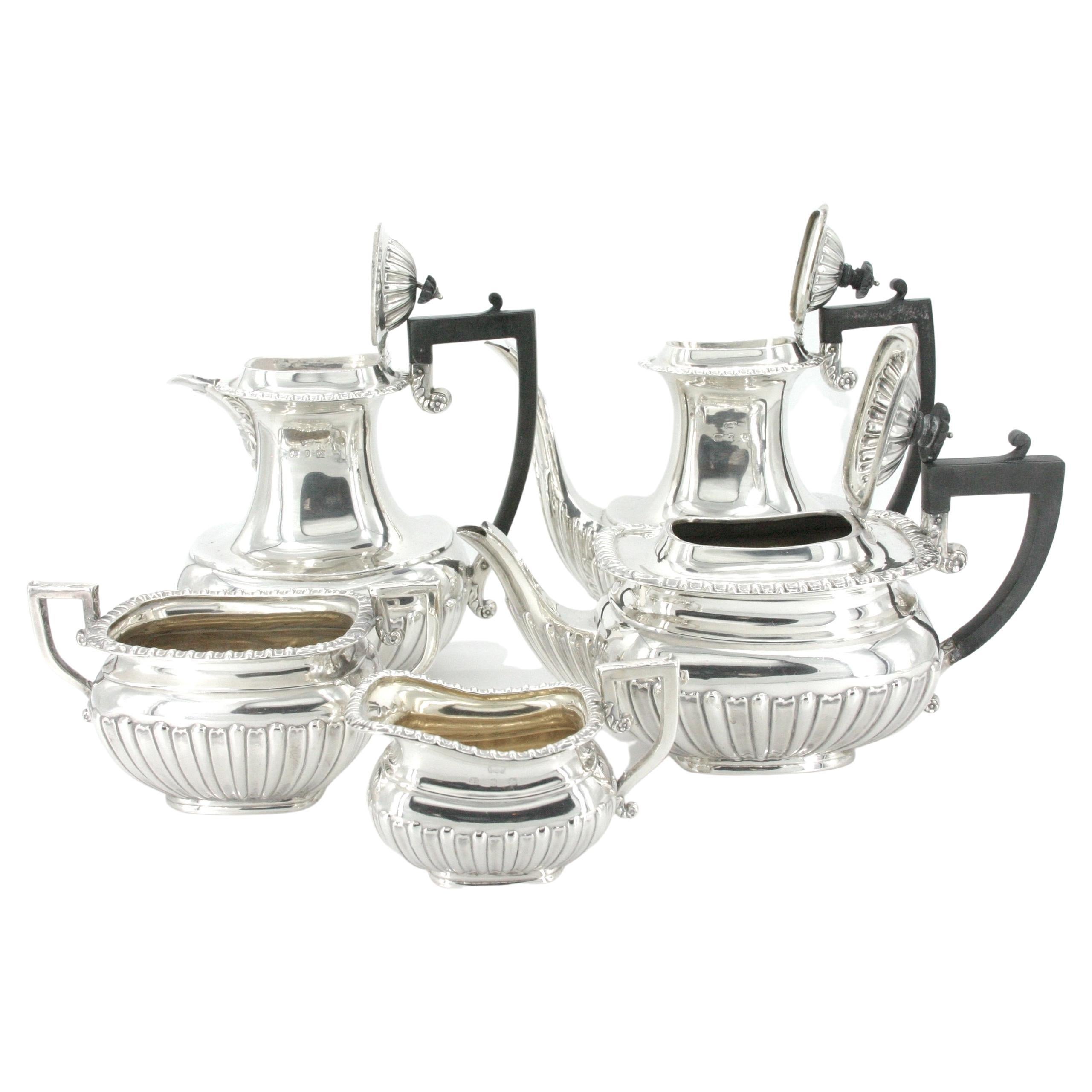English sterling sliver five piece coffee / tea service with black wood handle. Each piece is in great condition , minor wear consistent with age / use. Maker's mark undersigned, each piece is mark placing the set from 1901 year Sheffield England .