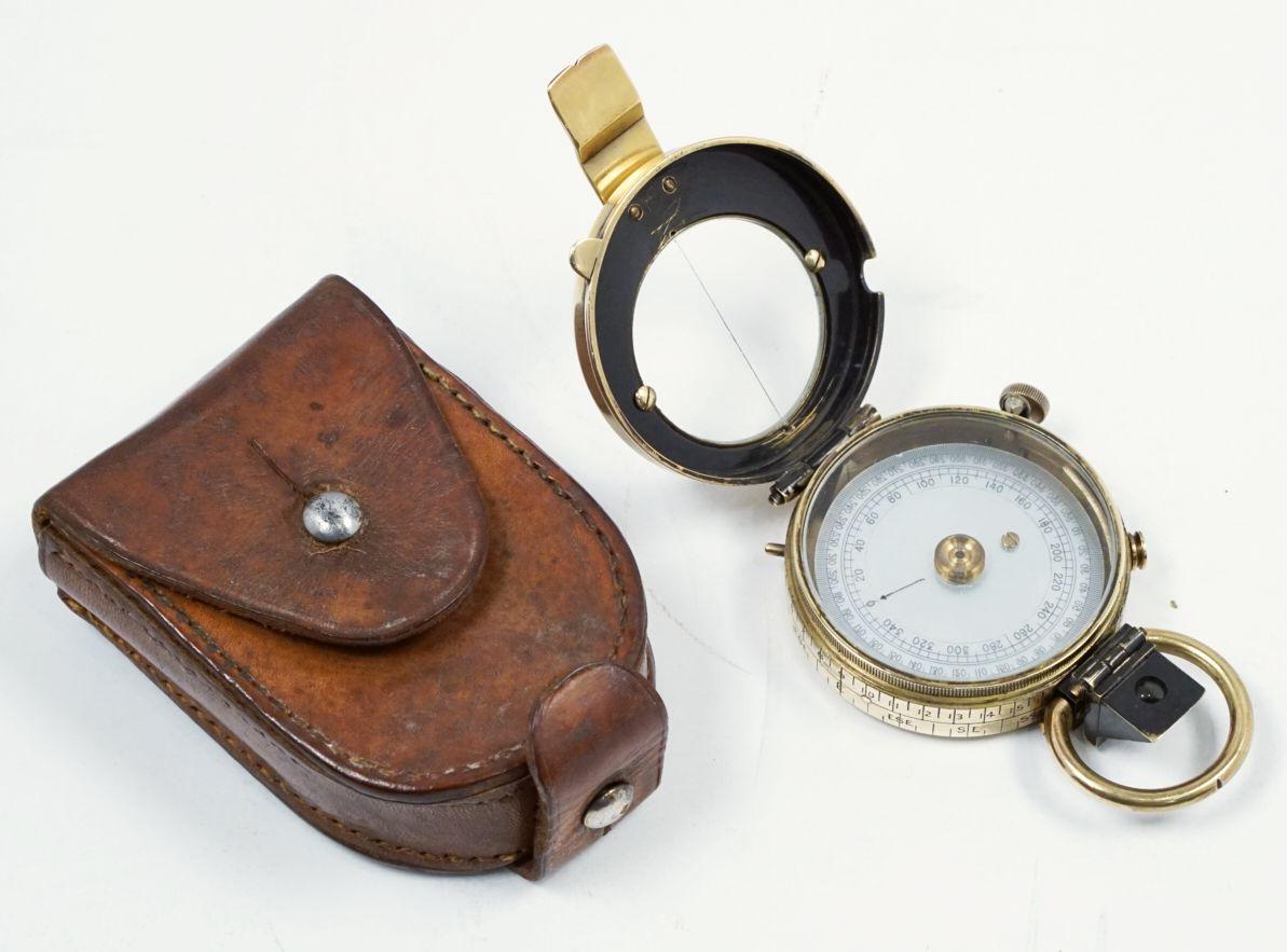A working British military officer's marching or sighting compass of heavy brass in original leather case from World War I, with mother of pearl dial.

By Negretti and Zambra, of London, England.

A handsome piece of militaria and a fine memento