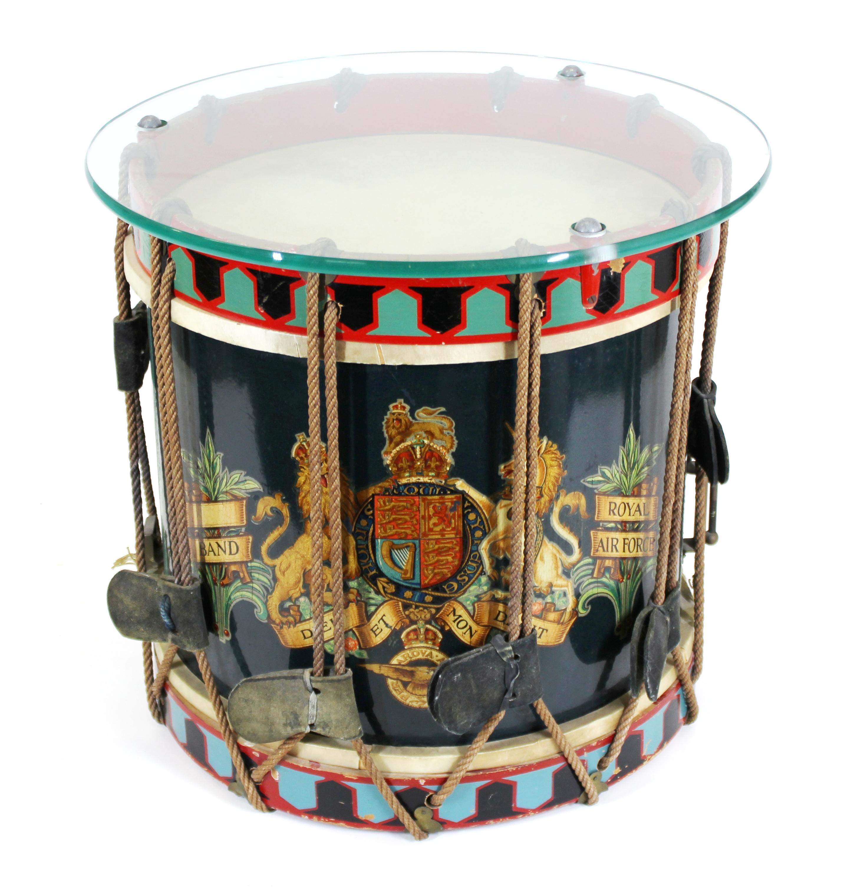 British Royal Air Force metal drum from the early 1940s, turned into a side table with a circular glass top. The piece has a hand painted full coat of arms on the front. Small hole in the top drum skin. A remarkable piece of British WWII memorabilia.