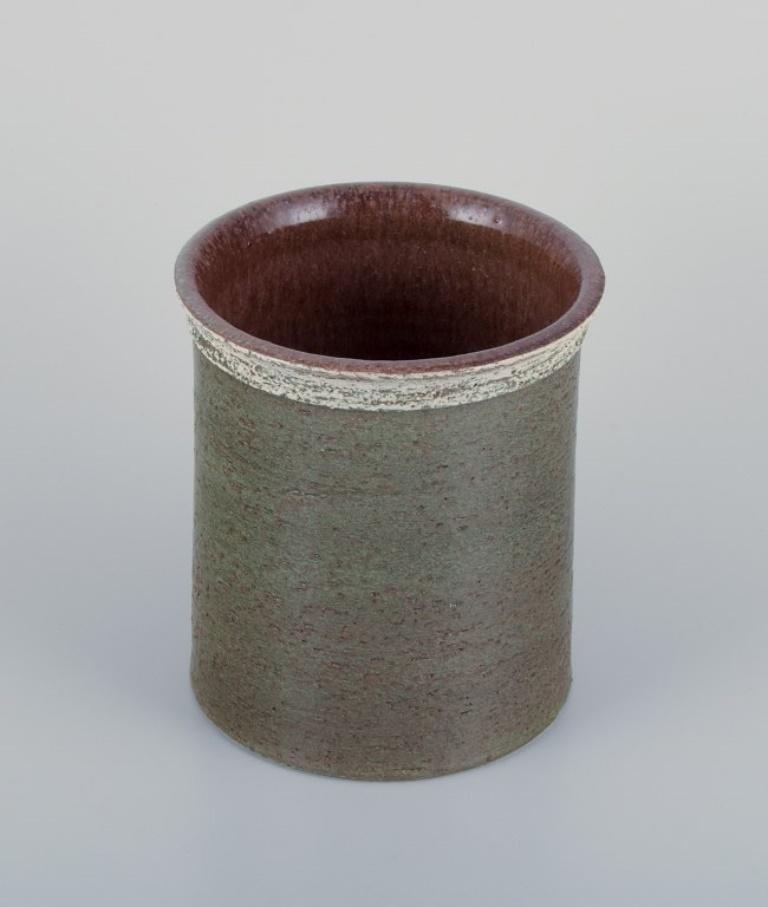 Britt-Louise Sundell (1928–2011) for Gustavsberg Studio, Sweden. 
Ceramic vase with glaze in greenish tones.
1960s.
Signed and stamped with Studio Hand mark.
In perfect condition.
Dimensions: D 15.0 cm x H 18.0 cm.

Britt-Louise Sundell emerged as a