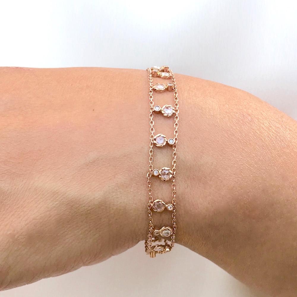 Drape your wrist with this precious ribbon made with delicate gold chain and sparkly diamonds. Brizo rose cut diamond ribbon bracelet features 15 sets of rose and brilliant cut diamond that alternate and spread along between two rails of delicate