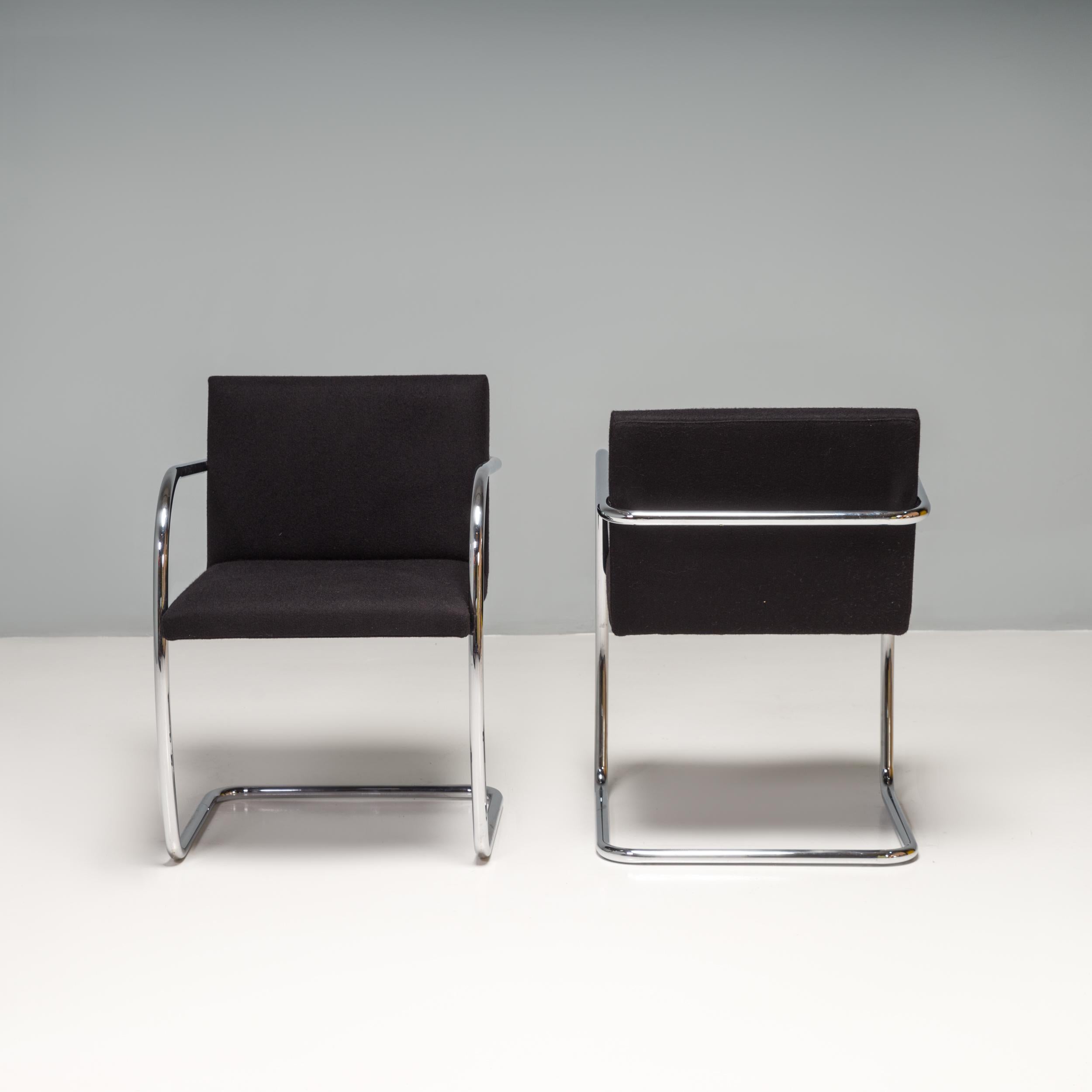 Originally designed by Mies van der Rohe in 1930 for his House in Brno, Czech Republic, the Brno chair remains a design icon. 

Sleek and simple, these cantilever chairs are upholstered in black fabric and feature tubular chrome frames with curved