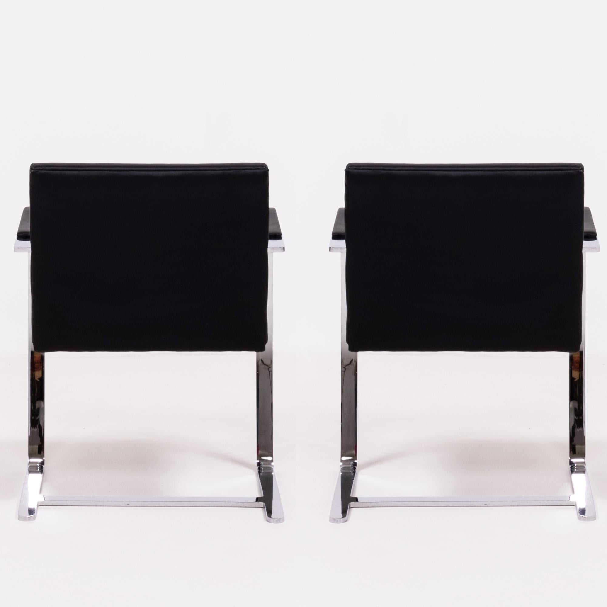 Originally designed by Mies van der Rohe in 1930 for his House in Brno, Czech Republic, the Brno chair remains a design icon.

Sleek and simple, this set of two chairs are upholstered in black leather and feature slim chrome frames with curved